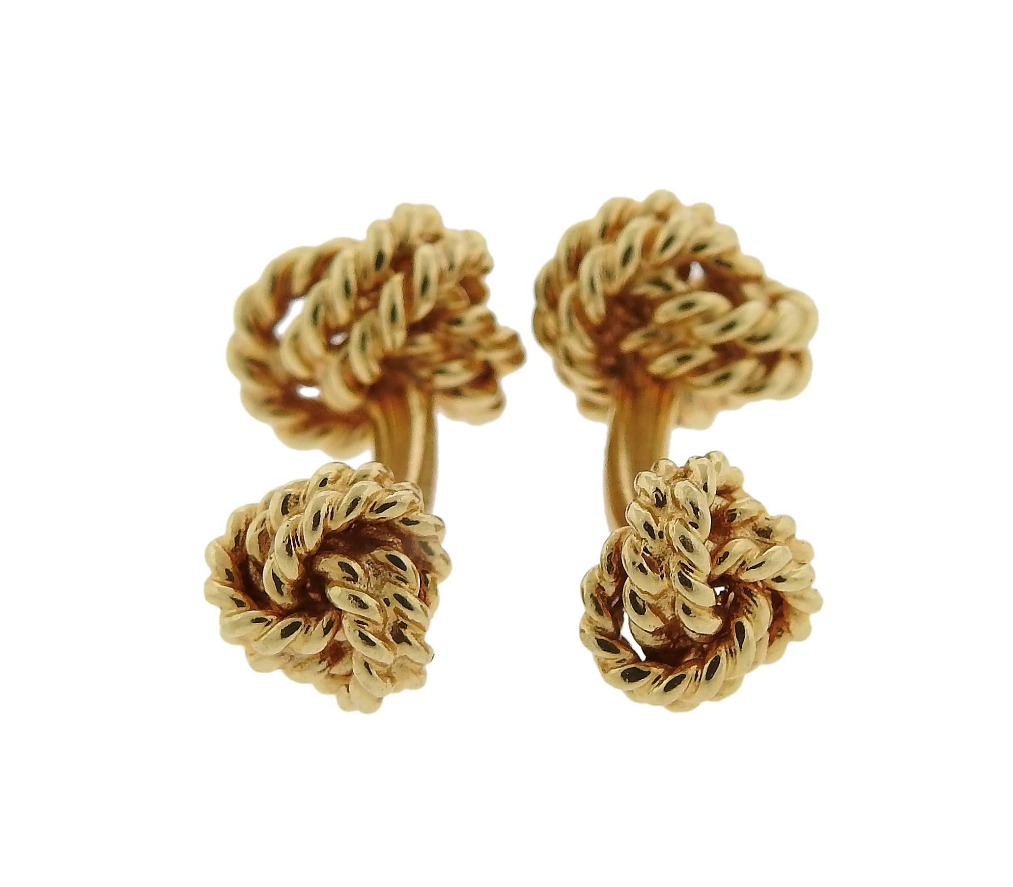 Pair of classic 14k yellow gold woven knot cufflinks, crafted by Tiffany & Co. Top measures 13mm x 12mm, and weigh 15 grams. Marked: Tiffany & Co, 14k. 