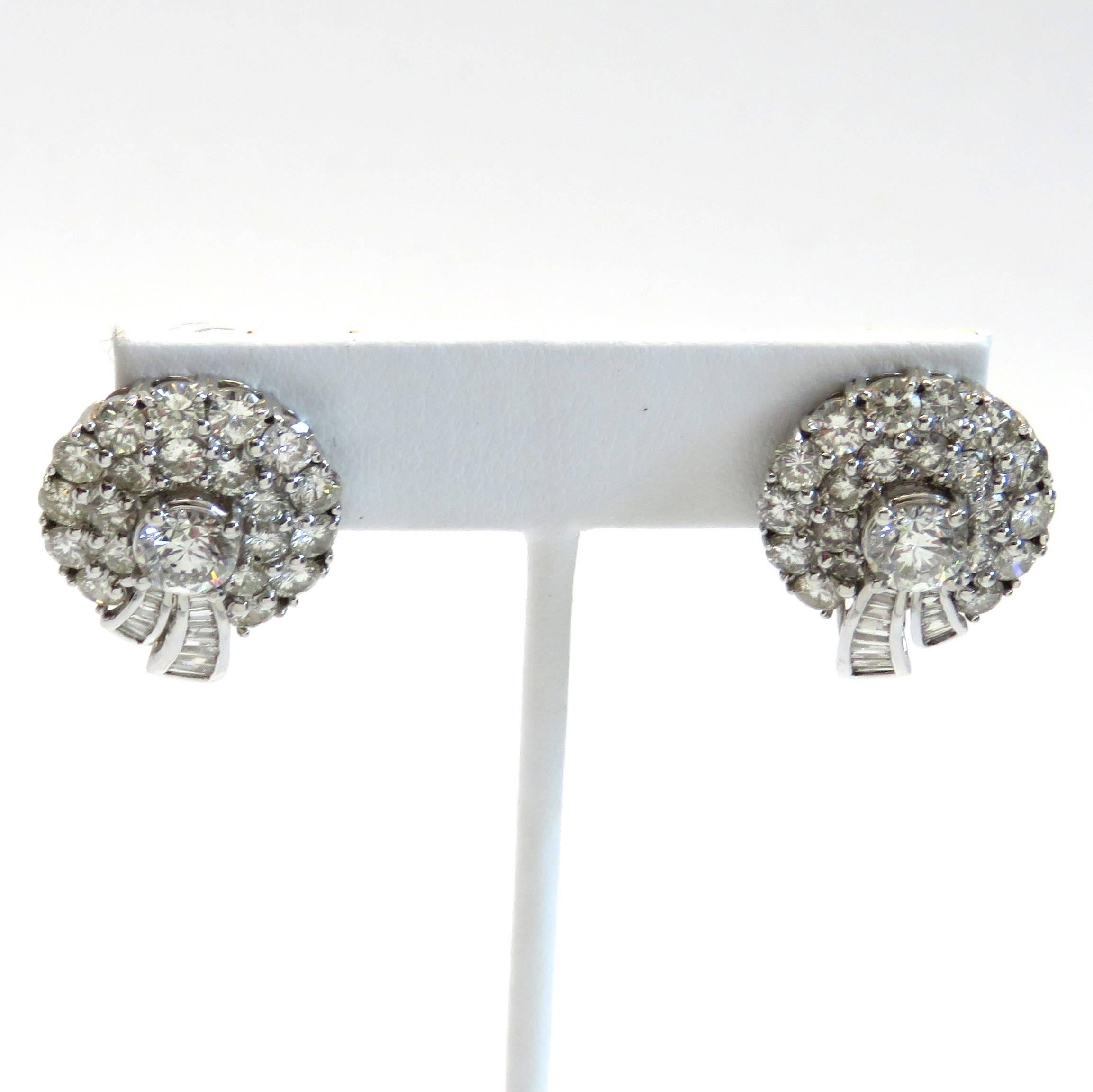 A pair of 18k white gold earrings set with approximately 5.50 carats of H/VS-SI1 diamonds.  The earrings measure 22mm x 18mm and weigh 10.5 grams. 