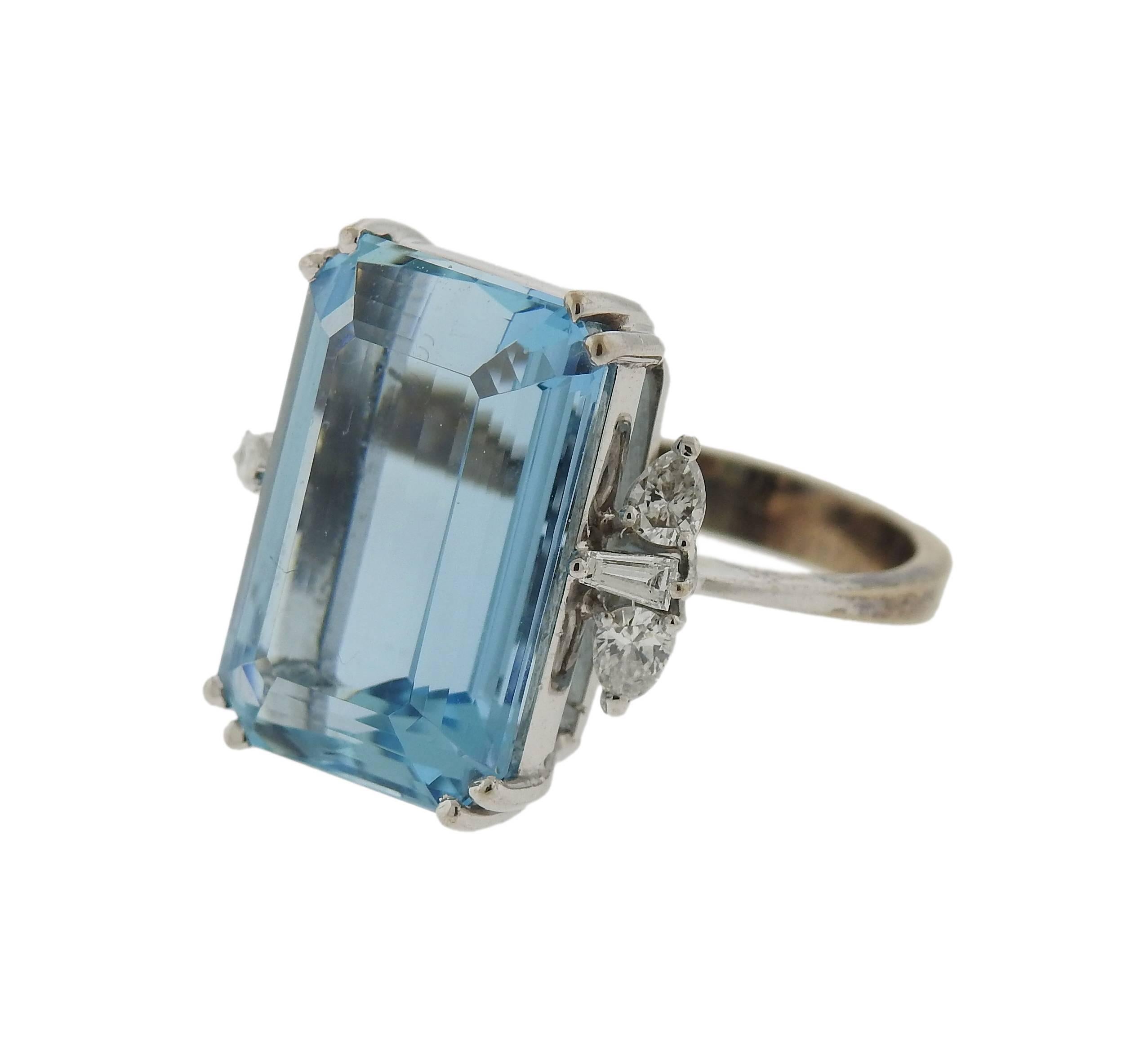 An 18k white gold ring, crafted by H. Stern, featuring approximately 14ct aquamarine, surrounded with 0.58ctw in diamonds. Ring size 7 , weighs 9.8 grams. Marked: S mark, 58, 750