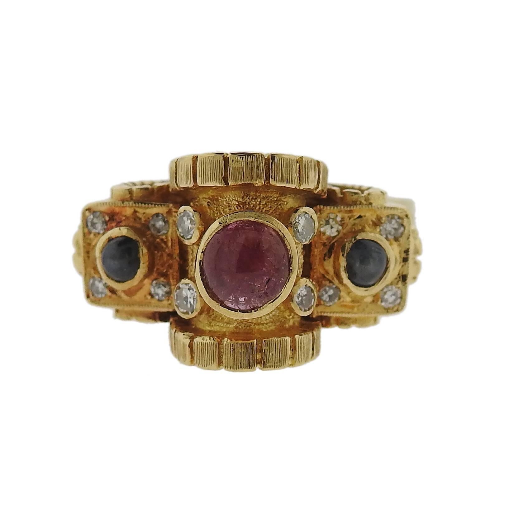 An 18k yellow gold ring, crafted by Greek designer Ilias Lalaounis, decorated with tourmaline cabochons, surrounded with diamonds. Ring is a size 6 1/2, ring top sits approx. 16mm from the top of the finger, measures 13mm x 20mm.  Marked with
