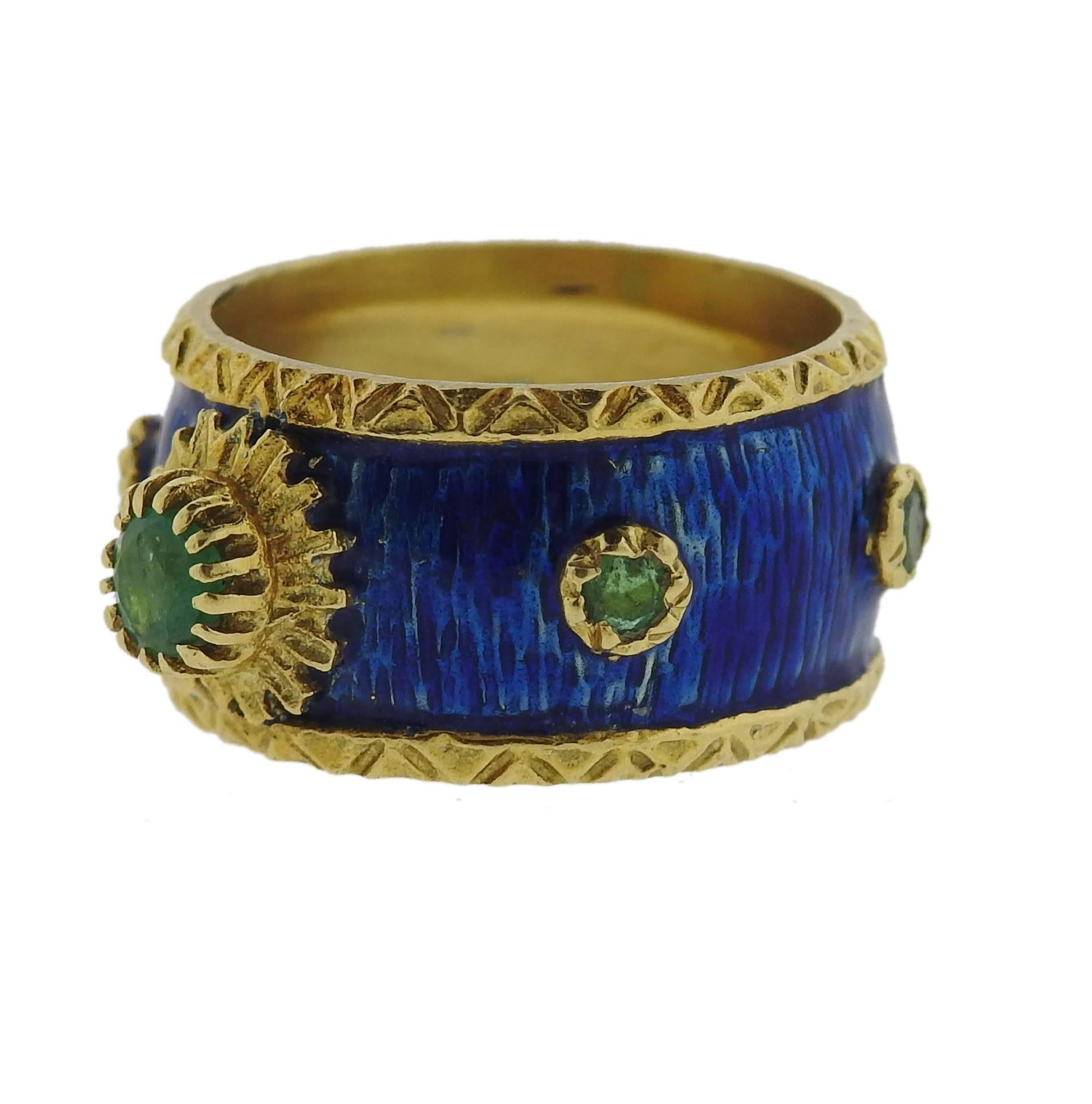 An 18k yellow gold band ring, crafted by Boris Le Beau, decorated with bright blue enamel and emeralds. Ring is a size 6 and is 10.5mm wide. Marked:  Boris, 18k. Weight - 10 grams 