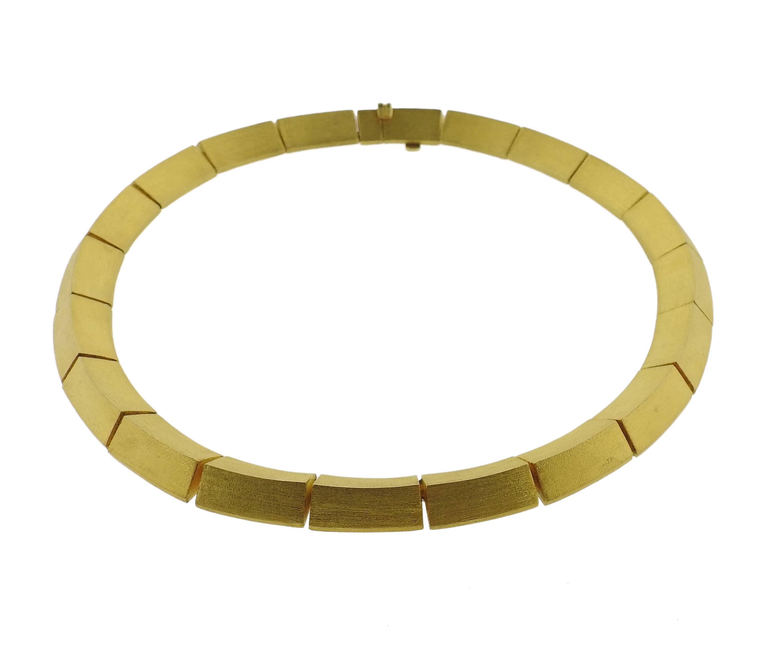 An 18k yellow gold necklace, crafted by Greek designer Maramenas Patras. Necklace is 15 1/2"; long and 13mm wide. Marked: 0.25 750 Maramenas Pateras. Weight - 85.5 grams 