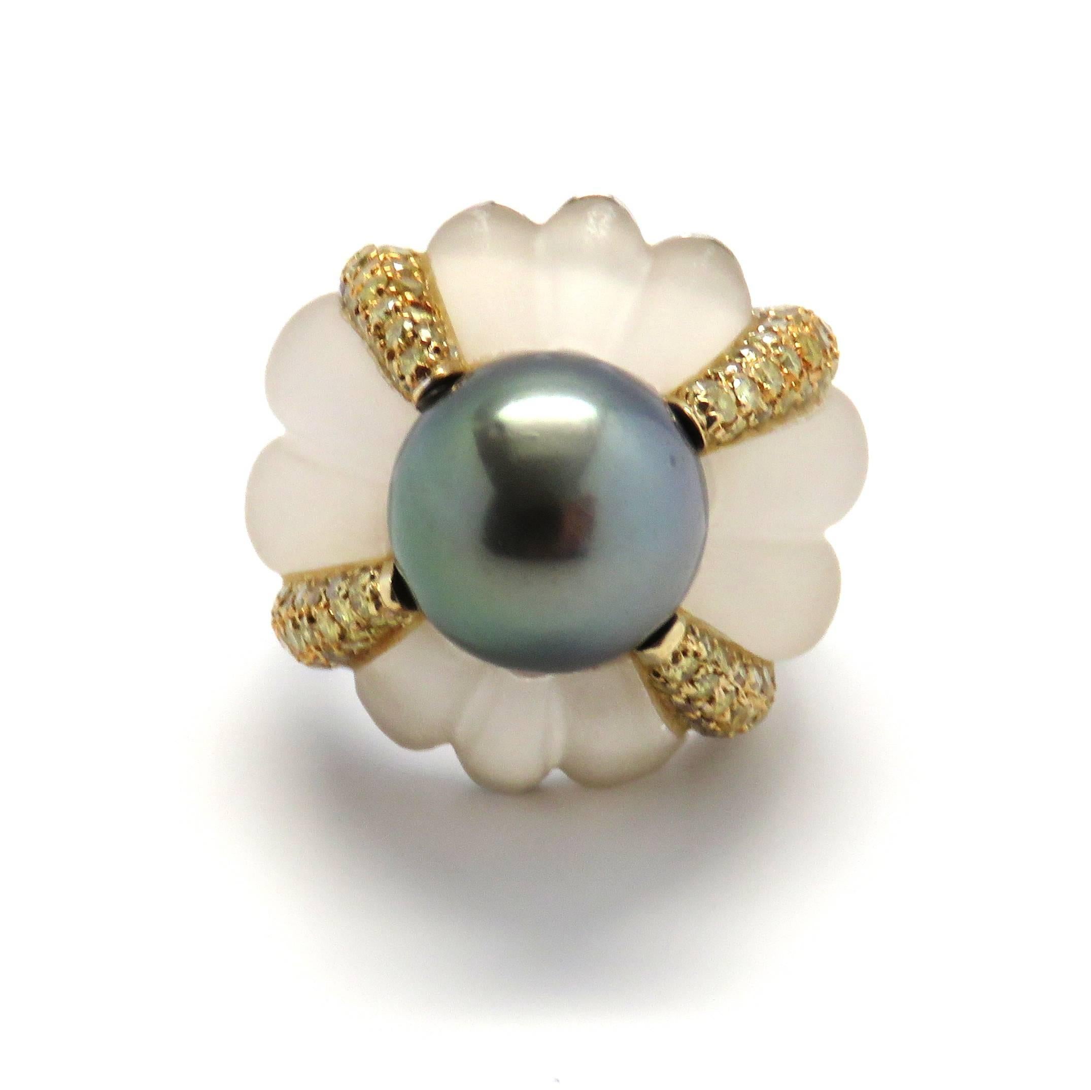 An 18k white gold ring adorned with rock crystal crafted by Salavetti, fancy color diamonds and a 12.7mm Tahitian pearl.  The ring is a size 6 and weighs 23.2 grams.  The top of the ring sits 16mm from the finger.