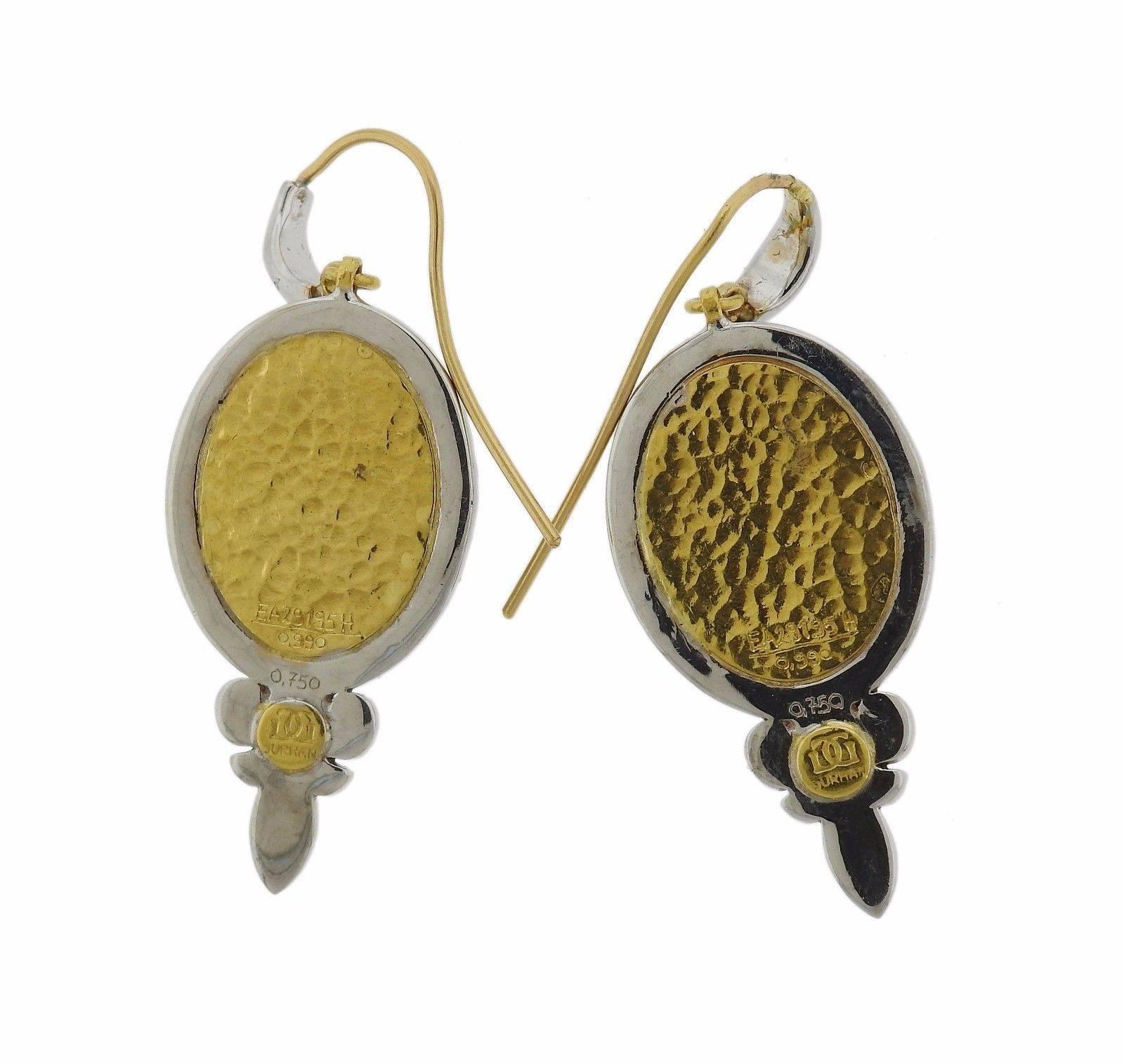 A pair of 18k and 24k gold earrings set with turquoise cabochons and approximately 1.84ctw of G/VS diamonds.  The earrings measure 45mm x 28mm and weigh 16.6 grams.  Marked: Gurhan mark, 0.990, 0.750, EA29195H. 