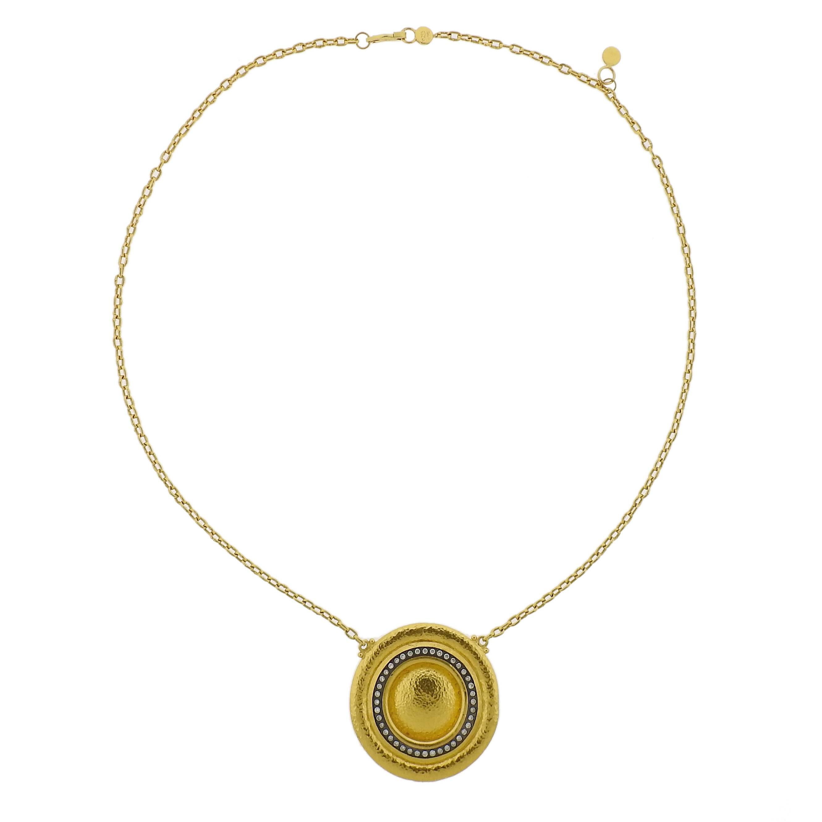 24k yellow gold necklace, featuring 36mm circle pendant, decorated with approximately 0.55ctw in diamonds. Crafted by Gurhan, necklace is 18 1/4" long and weighs 23.7 grams. Marked with Gurhan hallmark, NY293, 0.990. 