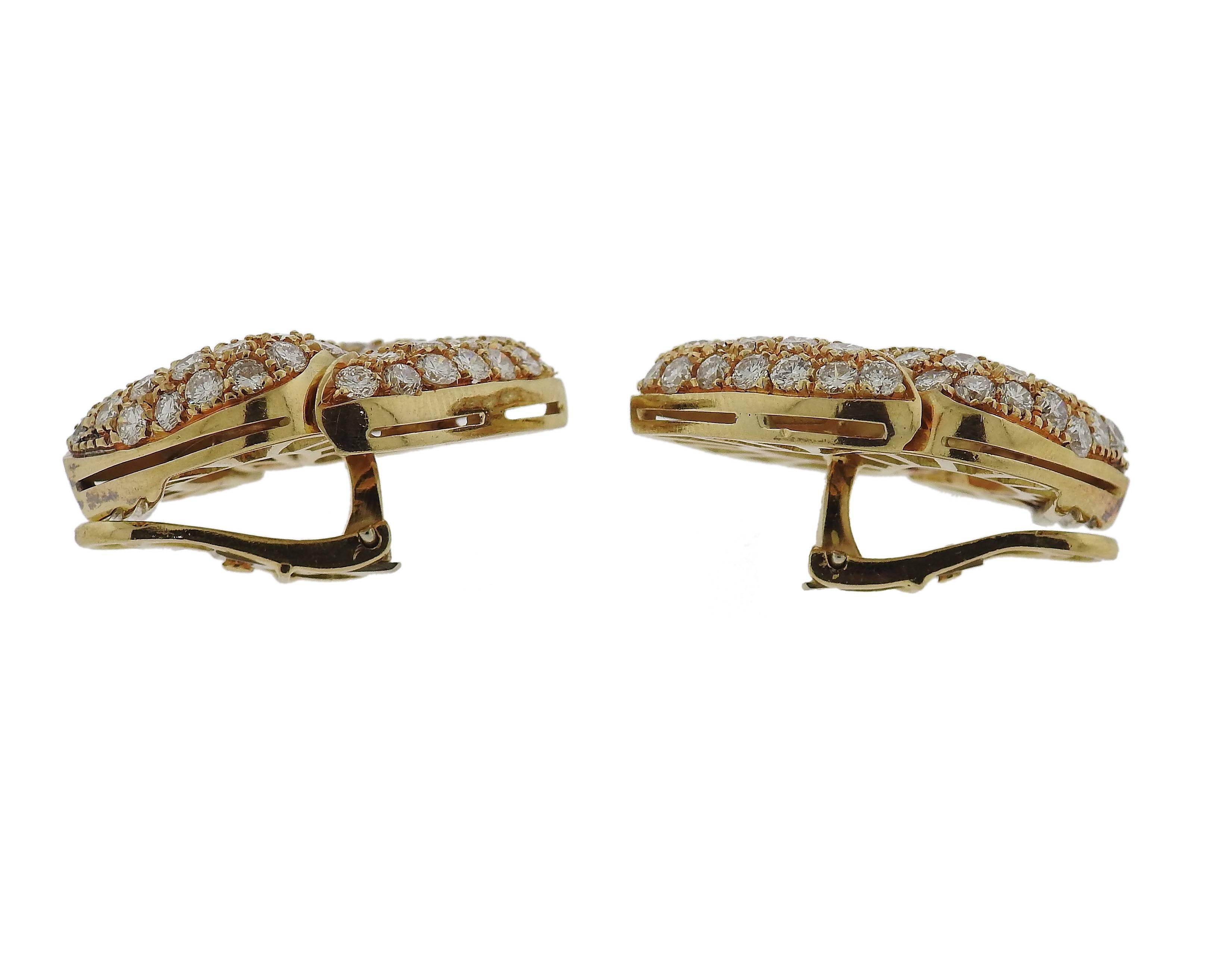 Pair of impressive 18k gold earrings, set with approximately 6 carats in VS-F/G diamonds. Earrings are 28mm x 23mm  and weigh 25.1 grams 
