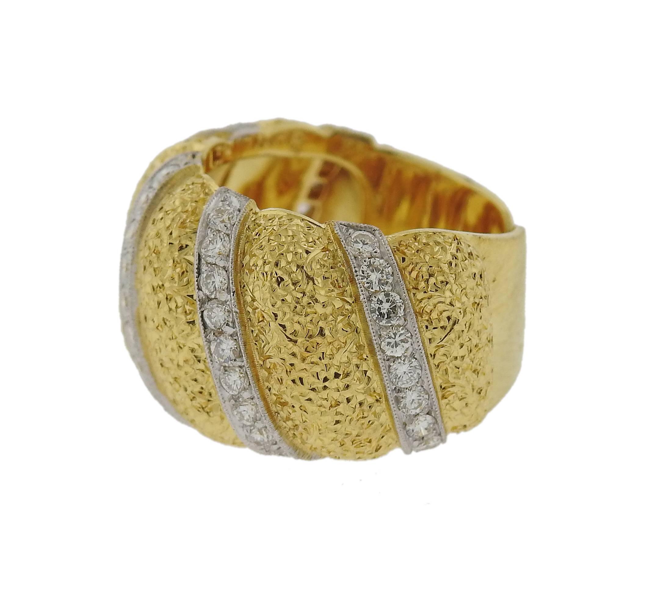 Wide 18k gold ring, crafted by Bucellati, set with approximately 0.80ctw in diamonds, featuring open cuff shank design.  Ring is a size 6 and is 14mm wide. Weighs 14.6 grams. Marked: Gianmaria Buccellati, Italy 18k 
Retail $24530