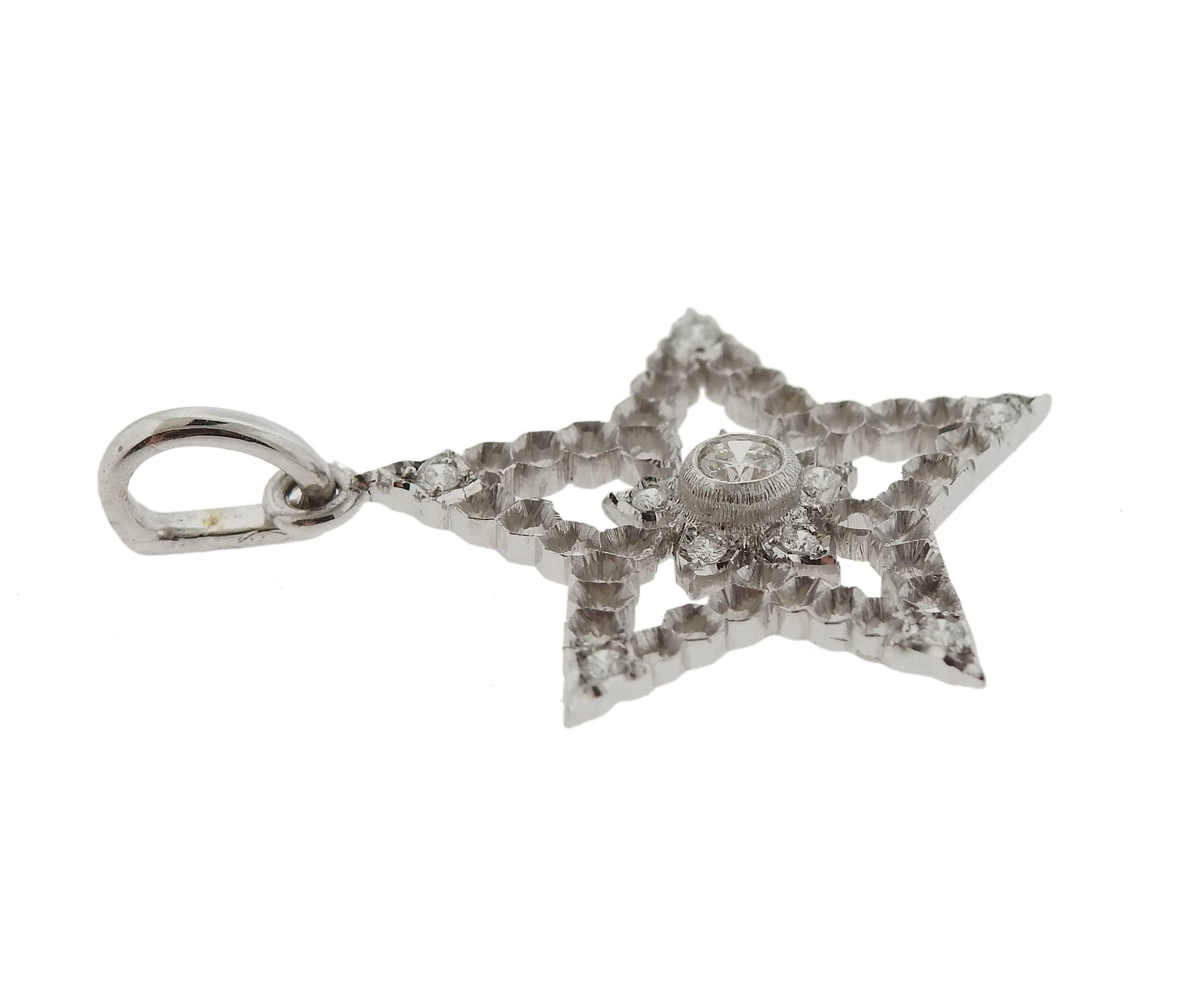 18k white gold star pendant, crafted by Buccellati, set with approximately 0.15ctw in diamonds. Pendant is 30mm long with bale x 22mm and weighs 2.4 grams. Marked: F2998, Italy 18k,  Buccellati 
Retail $3790