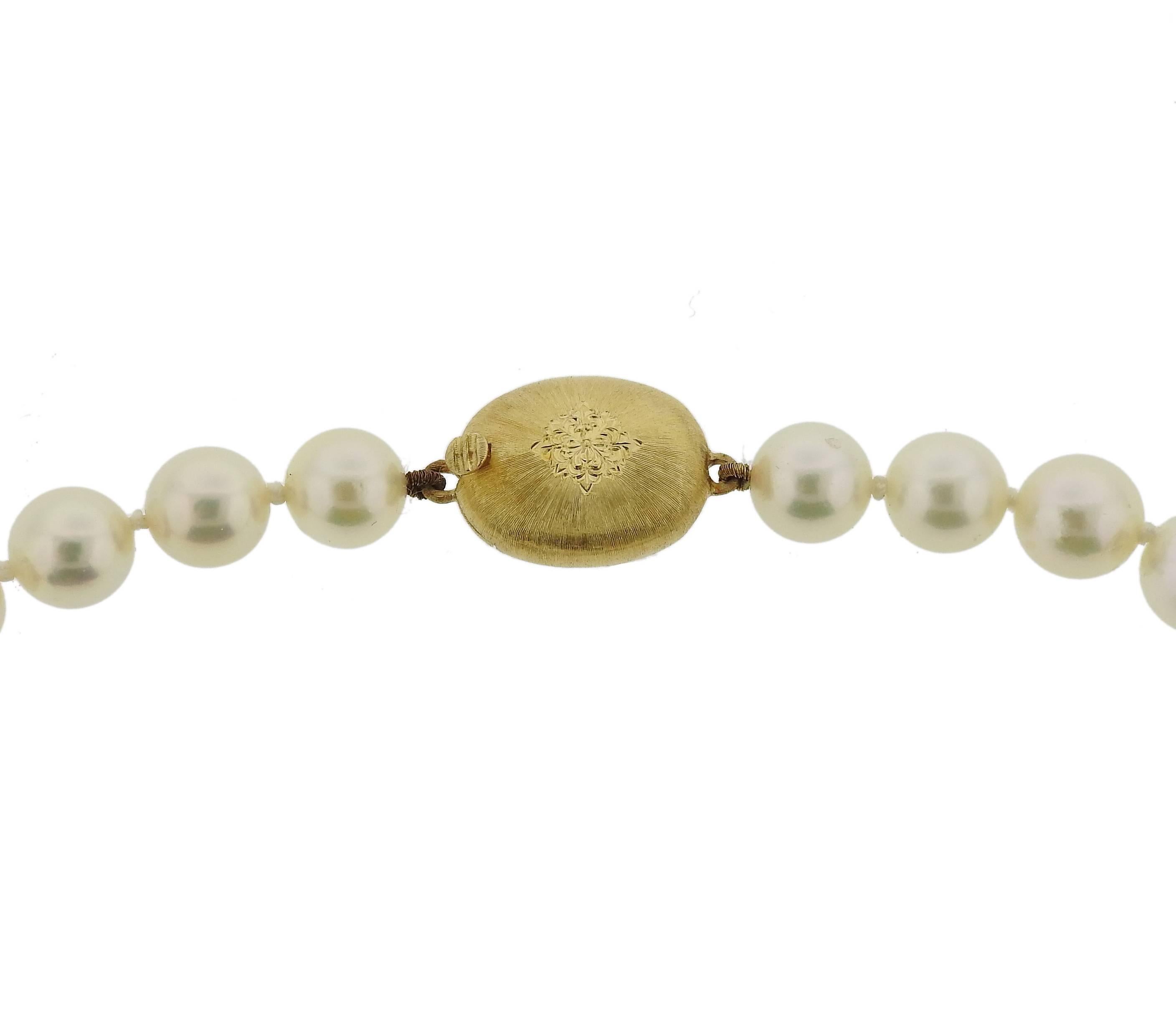 Classic pearl necklace, crafted by Buccellati, set with a classic 18k yellow gold clasp. Necklace is 18 1/2