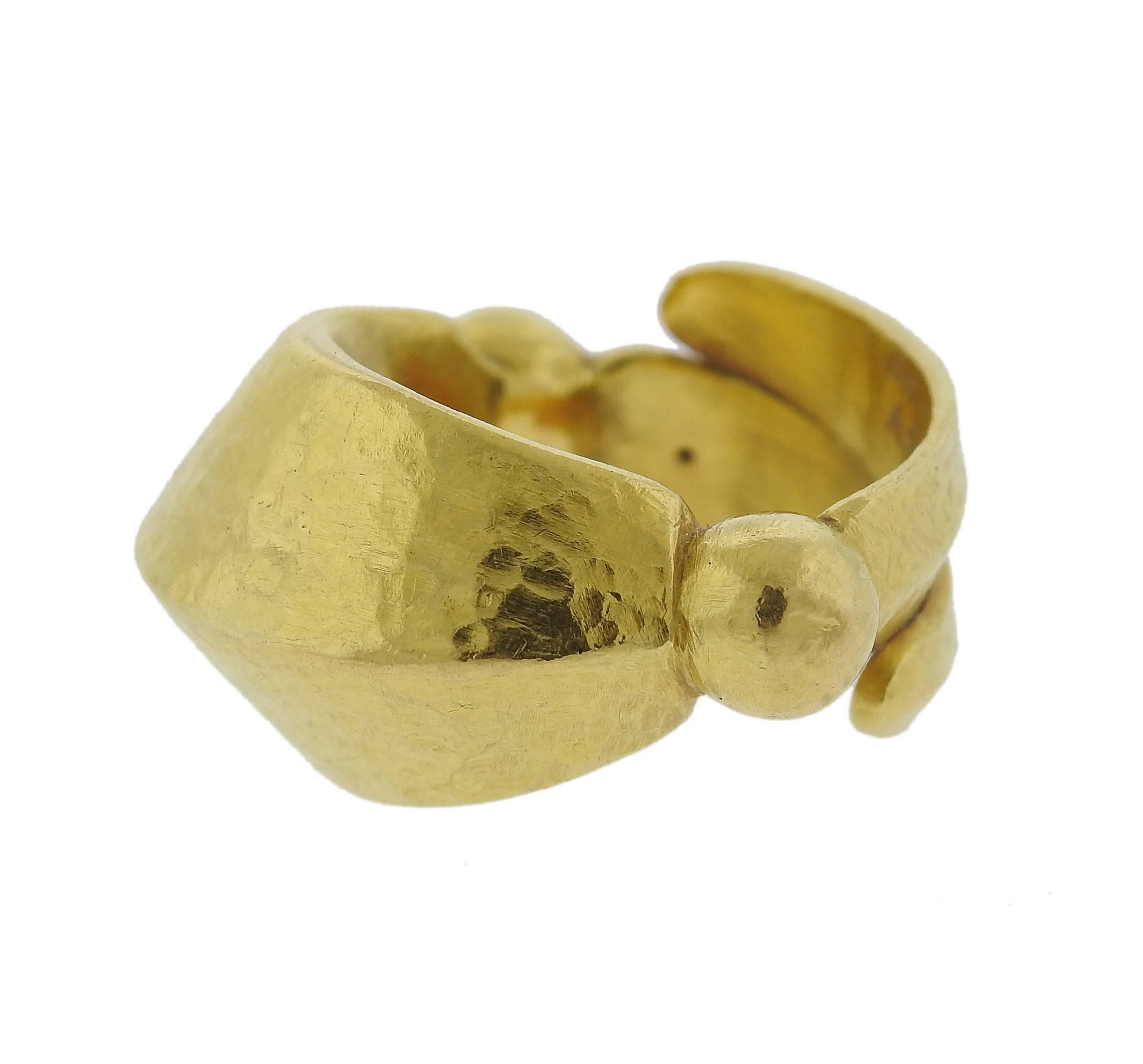A 22k yellow gold hand hammered ring, crafted by Greek designer Ilias Lalaounis. Ring is a size 3 3/4, ring top is 13mm wide. Marked: A.21, k22, Ilias Lalaounis. Weight of the piece - 8.3 grams