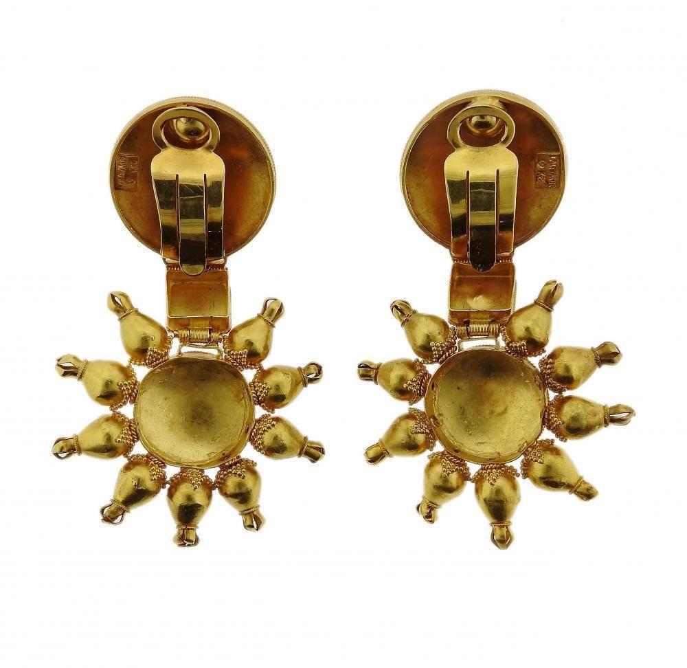 A pair of 22k yellow gold earrings set with rubies.  The earrings measure 64mm x 39mm and weigh 44.2 grams.  Marked: Maker's Mark, Lalaounis, k22.