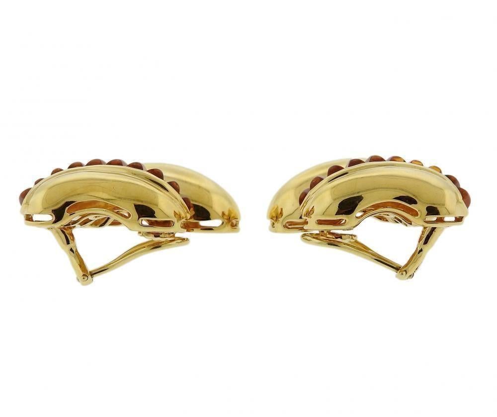 A pair of 18k yellow gold earrings set with sugarloaf cut citrines.  The earrings are 34mm x 22mm and weigh 26 grams.  Marked: Shell signature mark, 750.  Retail  $10,500.