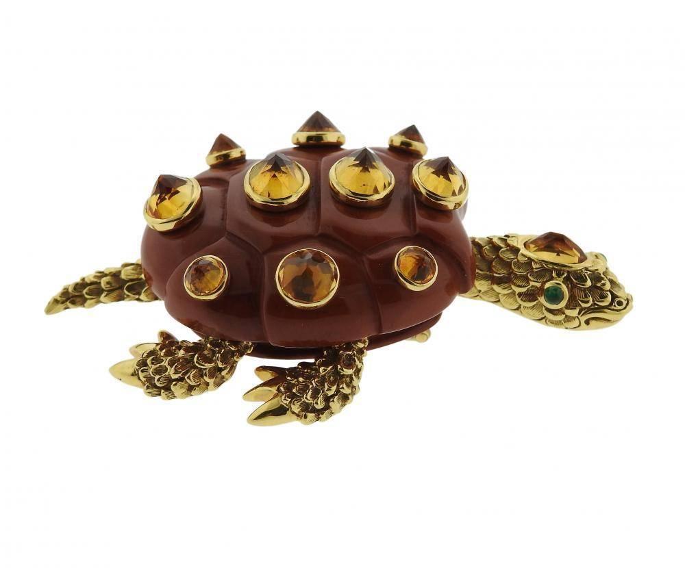 An 18k yellow gold turtle brooch set with Jasper, Citrine and Emeralds. The brooch measures 75mm  x 53mm and weighs 74.9 grams.  Marked: 7020, Shell signature mark, 750 , Seaman Schepps. 