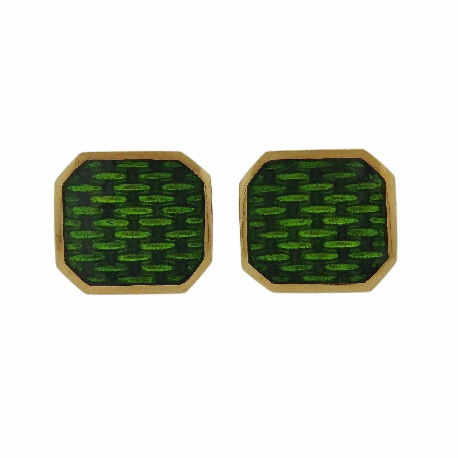 A pair of 18k yellow gold cufflinks adorned with green enamel.  The cufflinks measure15mm x 14mm and weigh 15.8 grams.  Marked: 18k.