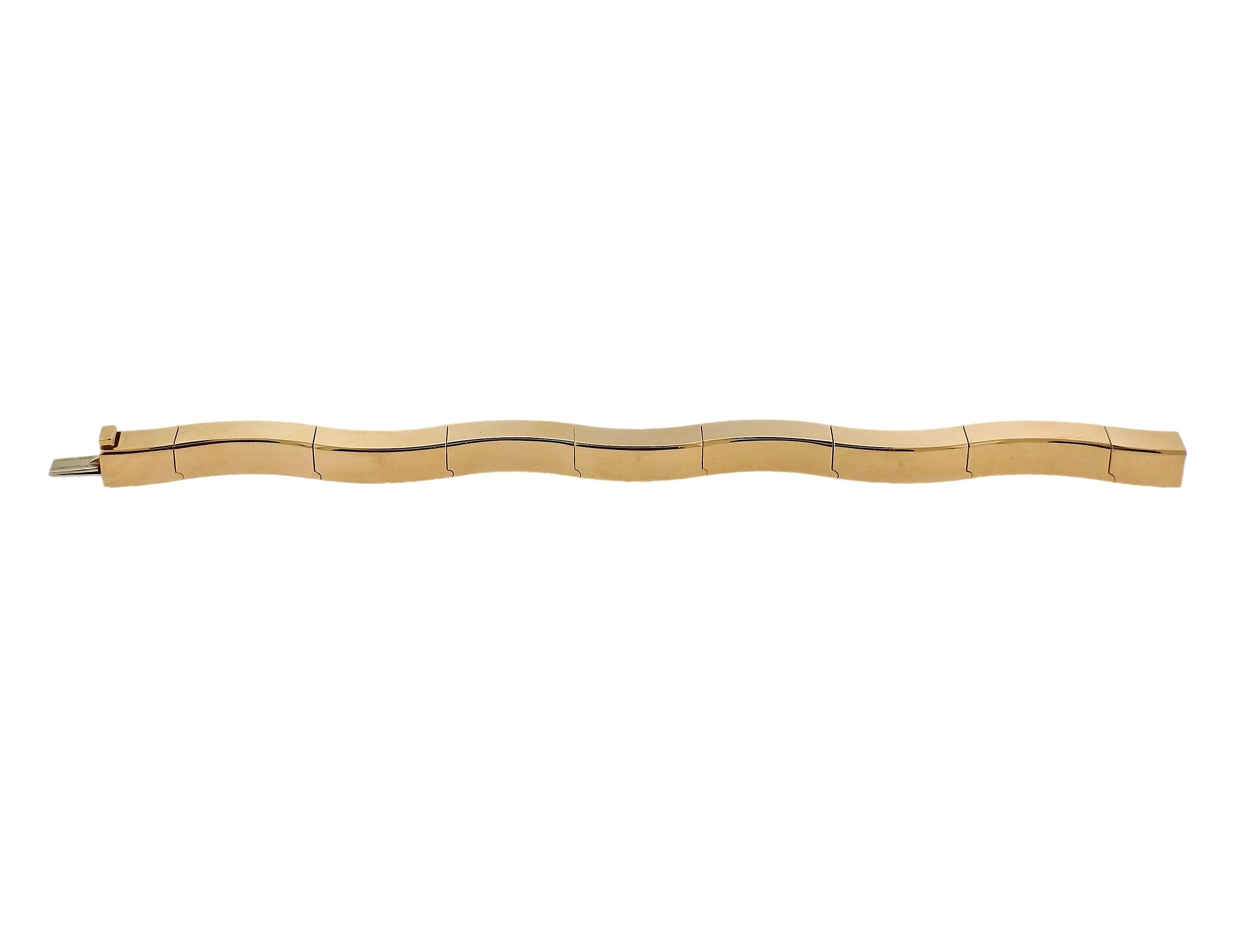 Beautiful 18k gold bracelet, set with approximately 1.40ctw in G/VS diamonds, crafted by Vhernier. Bracelet is 7" long and 7.5mm wide. Marked: 750 ,Vhernier, 27E. Weight - 66.4 grams 