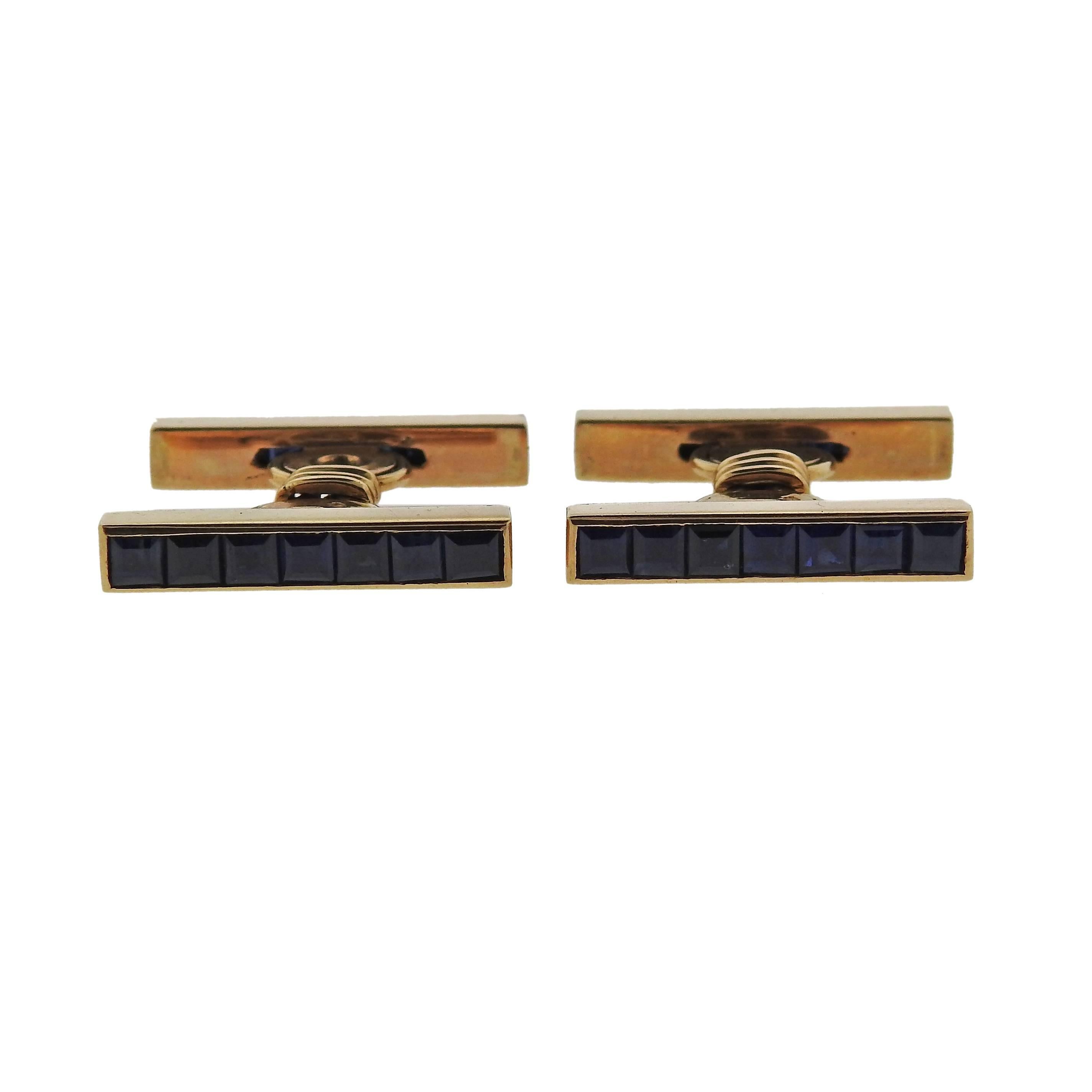Pair of 18k gold French cufflinks, decorated with blue sapphires. Cufflink top is 11mm x 4mm . Marked with French eagle gold marks. Weight - 11.5 grams.