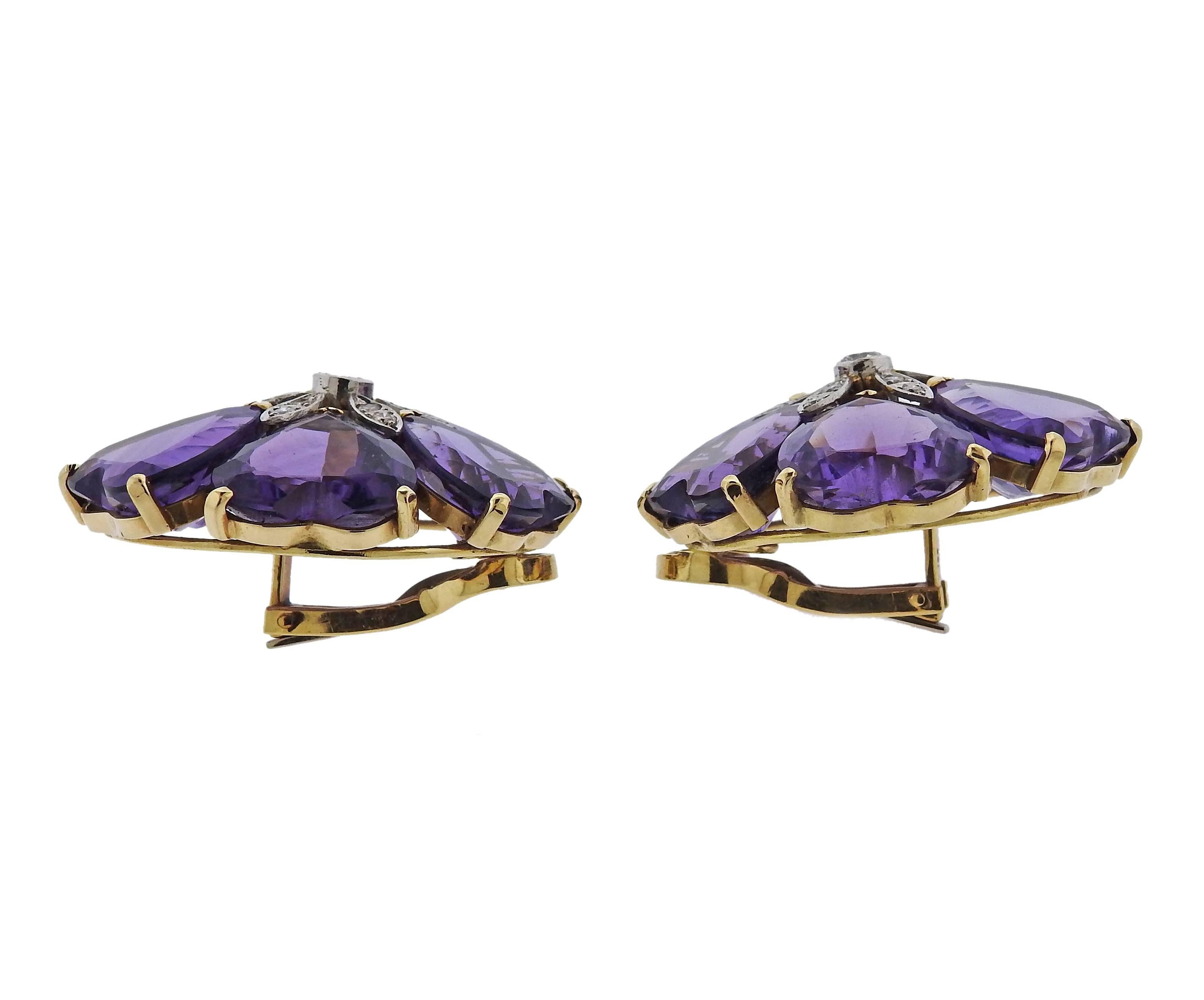 Pair of large 18k yellow gold flower motif earrings, set with heart shaped amethysts as petals, with approximately 0.84ctw in diamonds in the center. Earrings measure 36mm x 36mm, weight - 41.5 grams. Marked: 750 