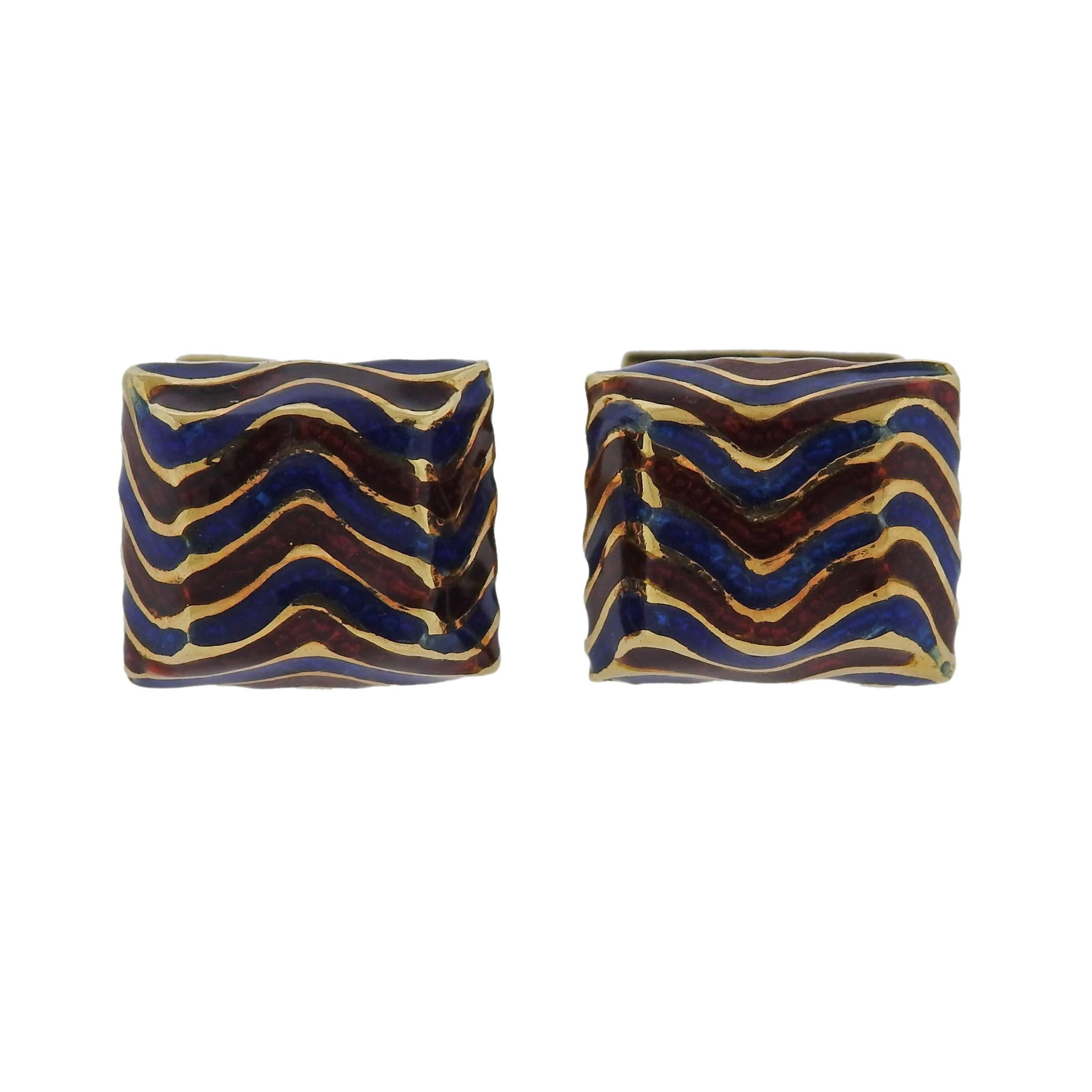 Pair of 18k gold cufflinks, crafted by David Webb, decorated with blue and red enamel wavy pattern design. Cufflink top measures 14mm x 12mm, back - 11.5mm x 10mm, weight - 15.1 grams. Marked: Webb, 18k