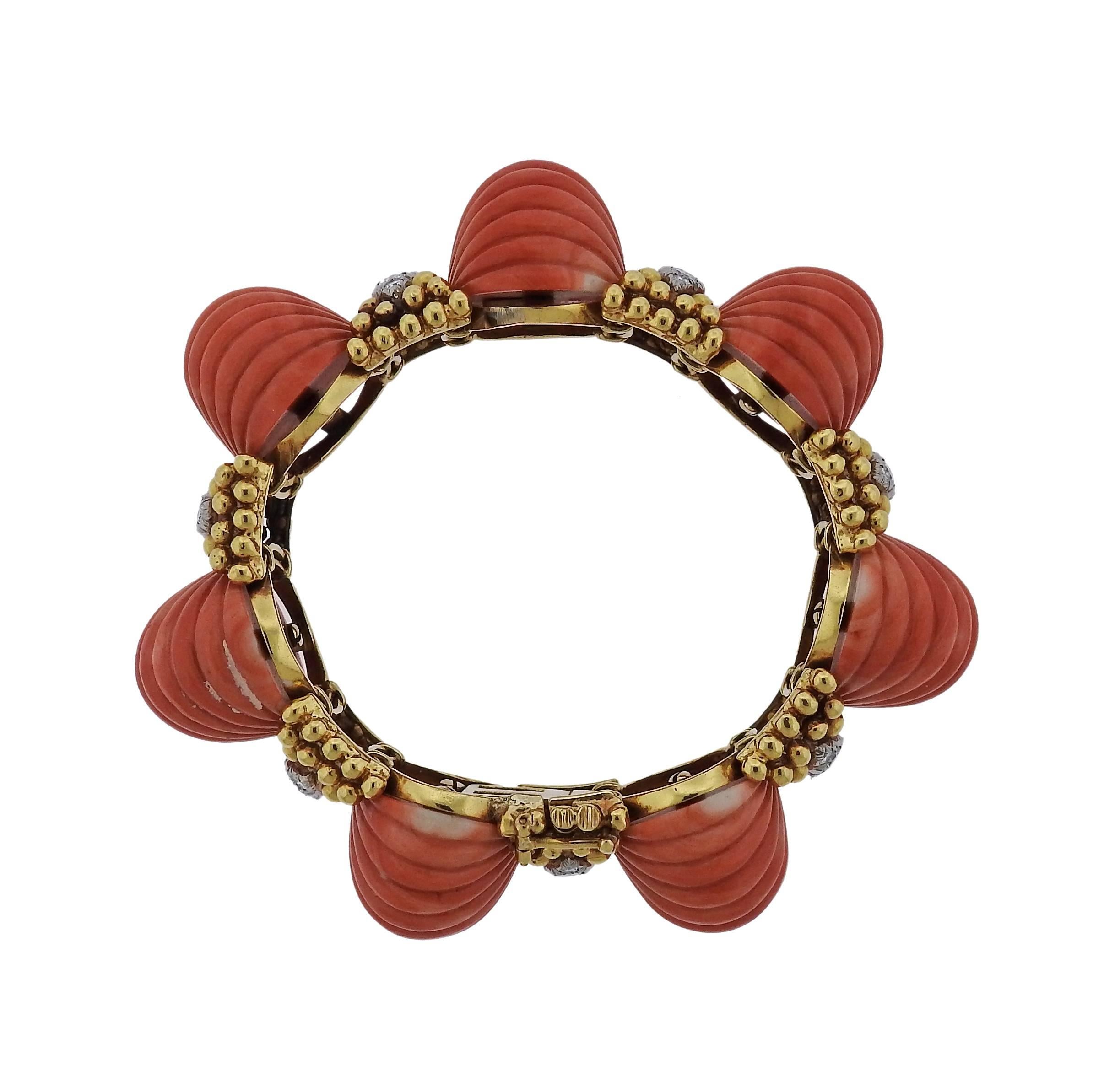 1970s platinum 18k gold carved coral bracelet crafted by David Webb. Features 1.75ctw of H/VS diamonds. Bracelet measures 6 1/2" long and is 23mm wide . Marked David Webb 18k Platinum. Weight is 112.9 grams. 