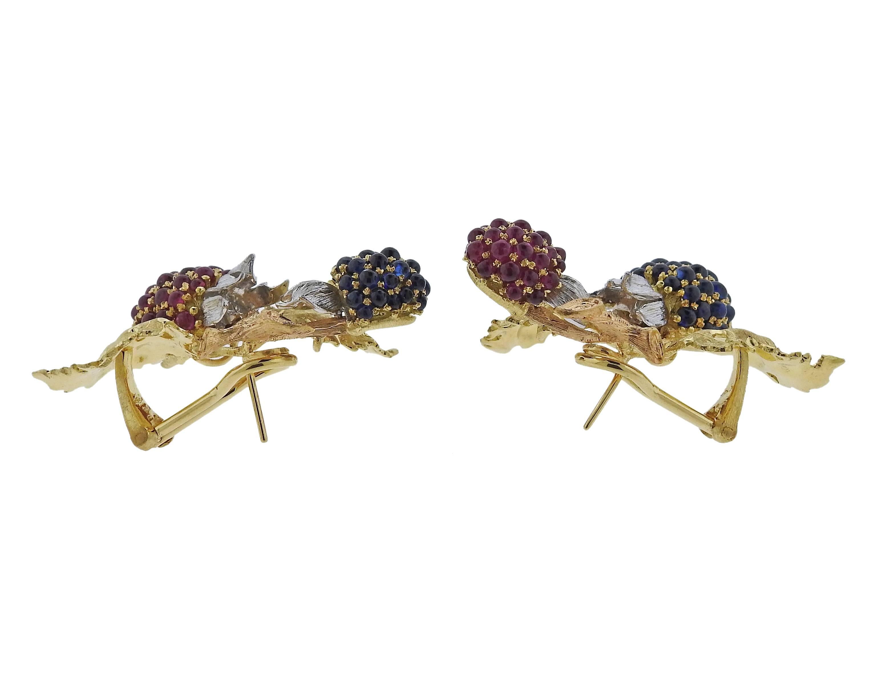 A pair of 18k gold berry earrings crafted by Buccellati. Earrings feature sapphires and rubies. Measure 41mm X 26mm. Marked L5495, 18k, Buccellati , Italy . Weight is 32.1 grams. Retail for $40700 come with paper work