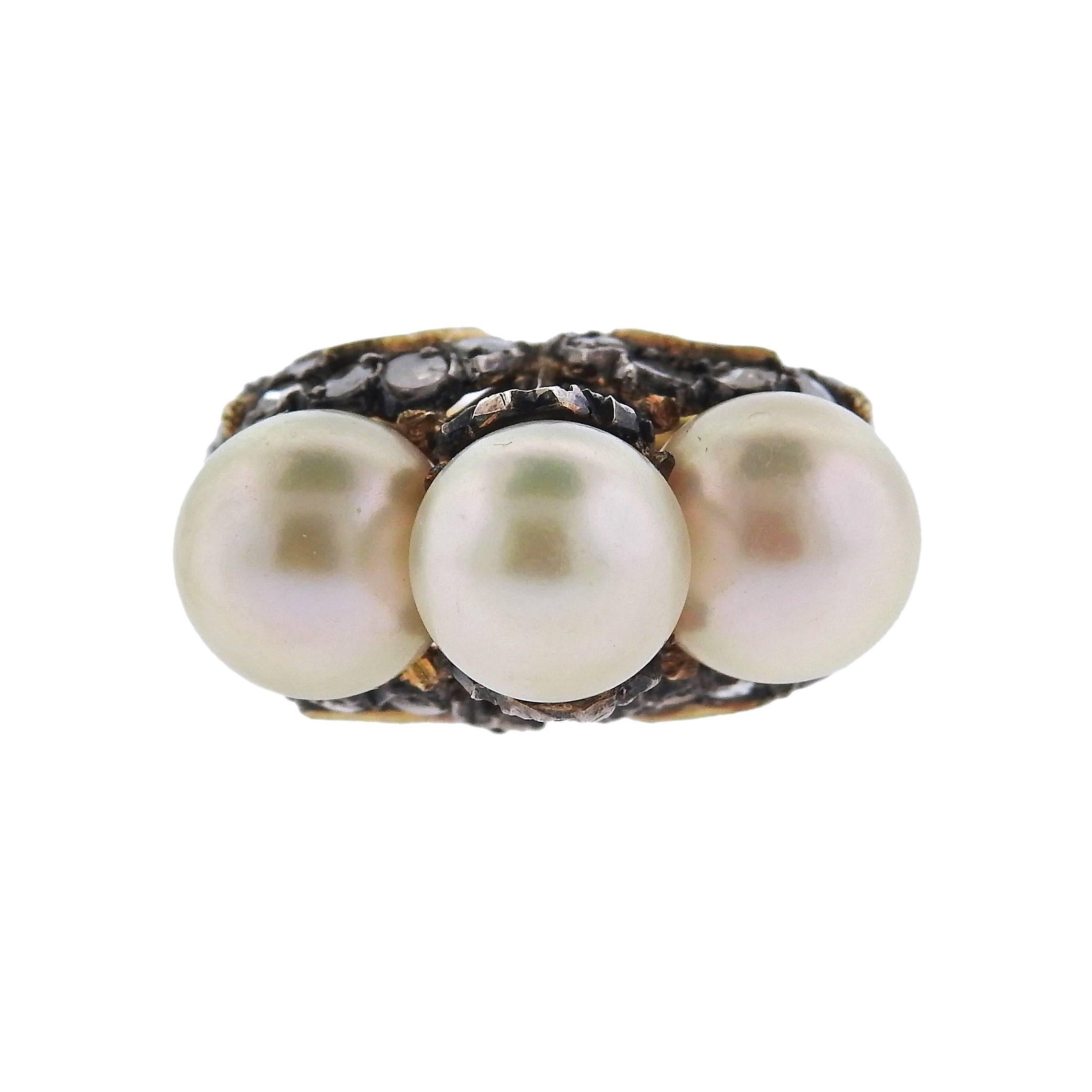 18k gold and silver ring crafted by Buccellati featuring a pearls ranging from 9 to 9.5mm in diameter and rose cut diamonds. Ring is a size 6, ring top is 13mm x 25mm. Ring sits approximately 19mm from finger. Marked T2631, Ialy, 18k, Buccellati .