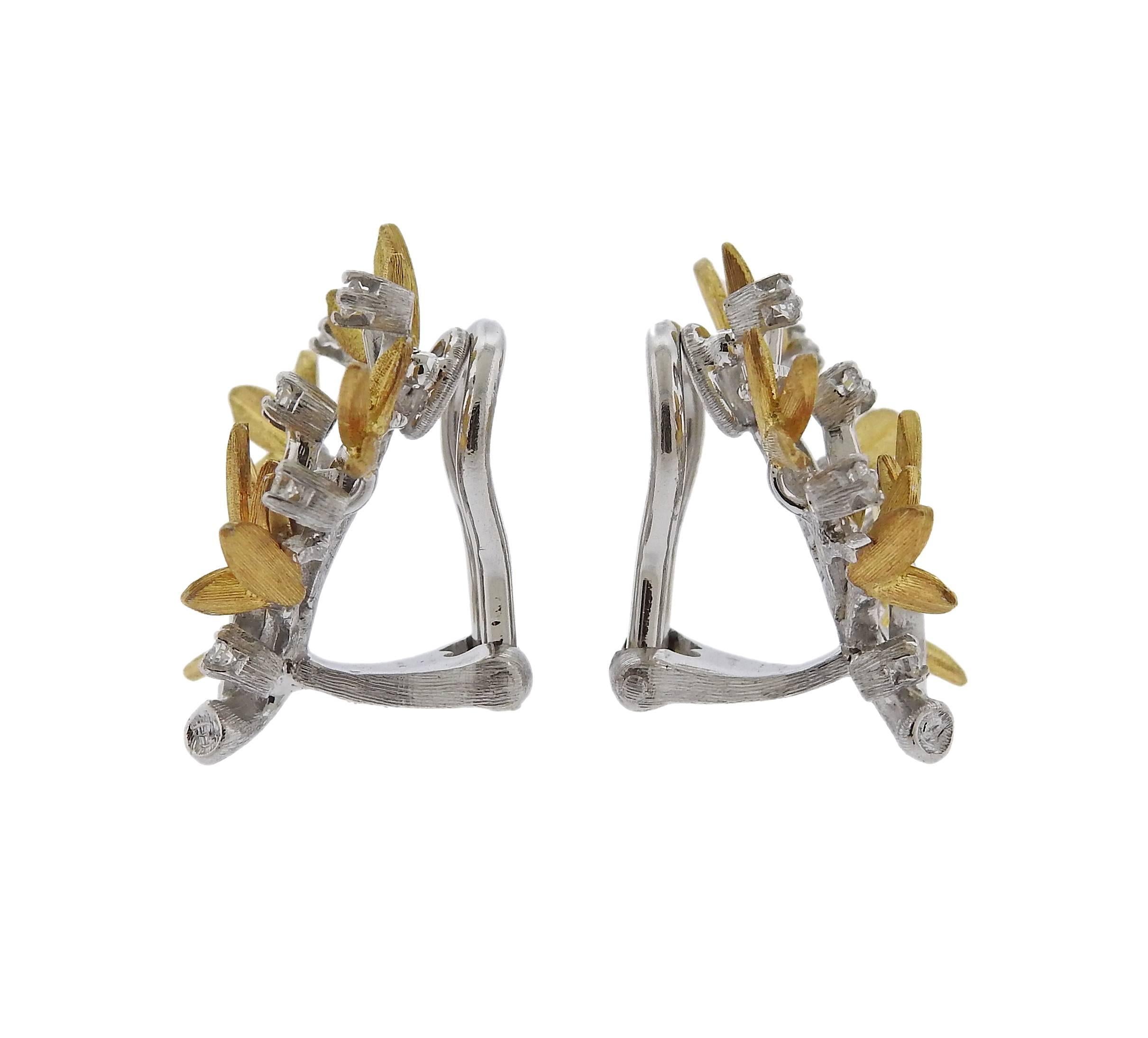 A pair of 18k gold diamond leaf motif earrings crafted by Buccellati. Earrings feature approximately 0.20ctw of H/VS diamonds. Earrings measure 24mm x 19mm. Marked Buccellati, Italy, 18k, H5527. Weight is 8.7 grams. Retail for $8,300 come with paper