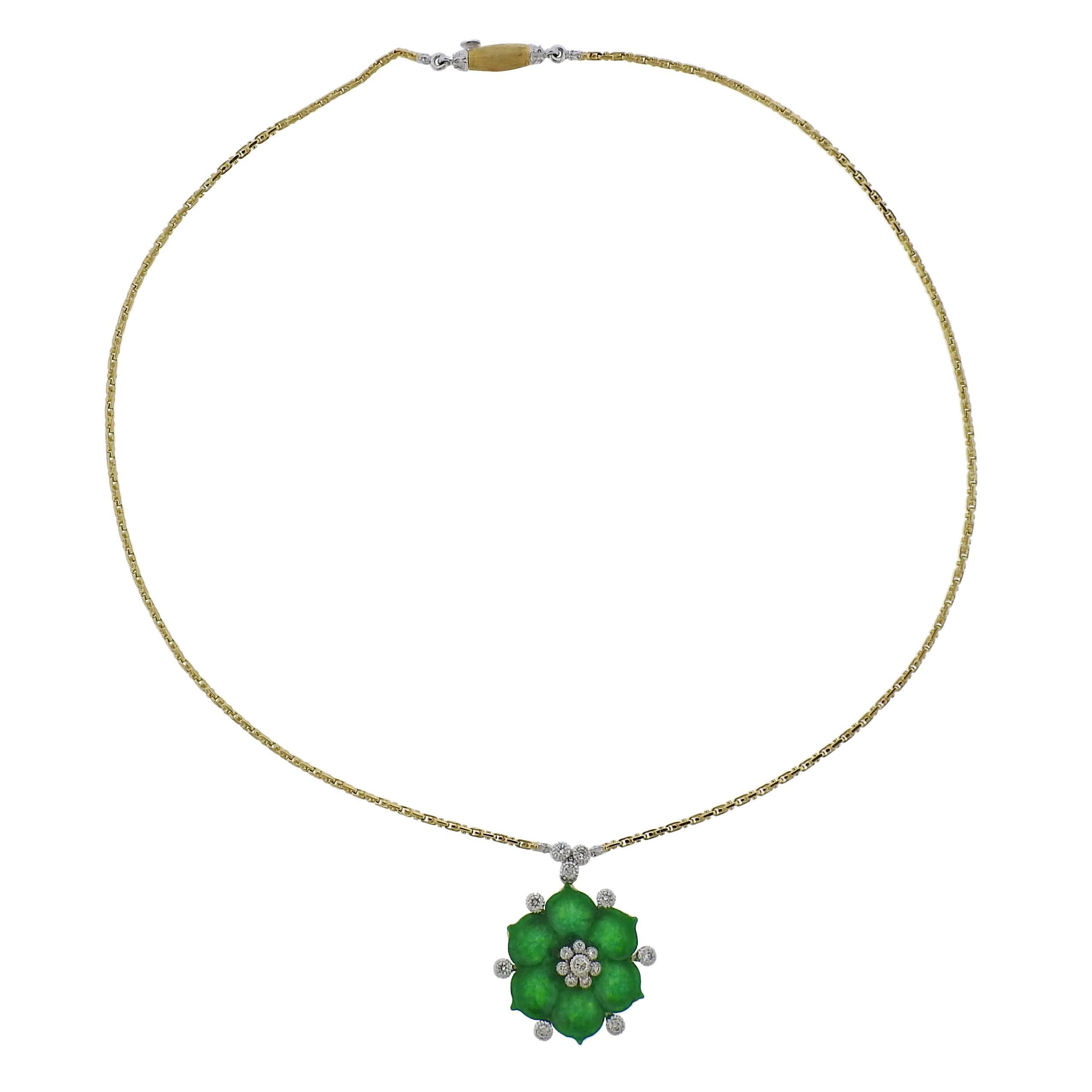 An 18K yellow and white gold necklace from Buccellati features a jade pendant decorated in diamonds. Necklace is 16" long, pendant measures 30mm long x 26mm wide. Marked Buccellati, Italy, 18k, R5998. Weighs 12.4 grams. Necklace comes with