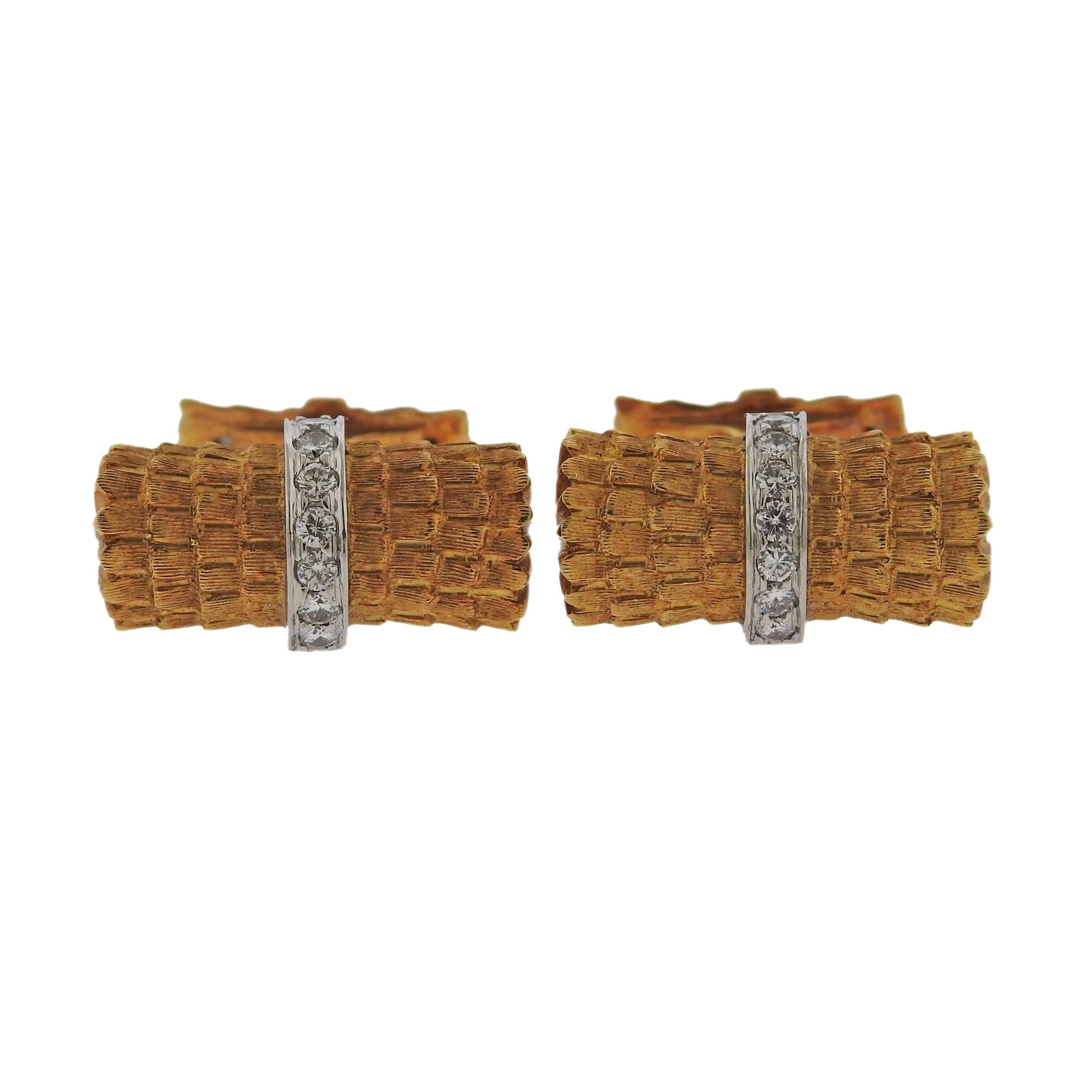 A pair of 18k gold and diamond cufflinks by Tiffany & Co. Cufflink tops measure 21mm x 11mm. Cufflinks are marked Tiffany & Co., 18K. Weigh 15.6 grams. 