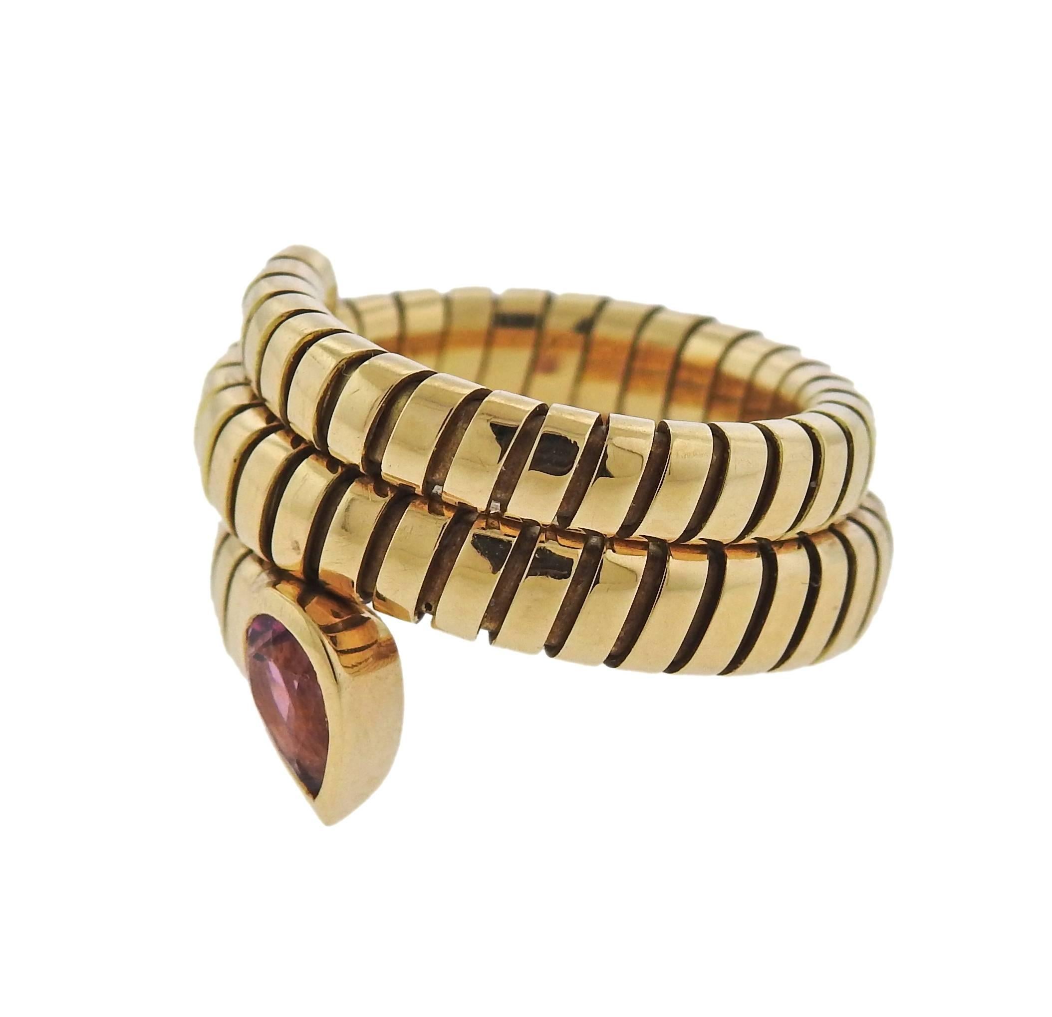 An 18k gold wrap ring, crafted by Bulgari for Tubogas collection, decorated with pink tourmaline. Ring size 7 (slightly flexible)  ring top is 18mm wide, weighs 15 grams. Marked: Bvlgari, 750, Italian mark 