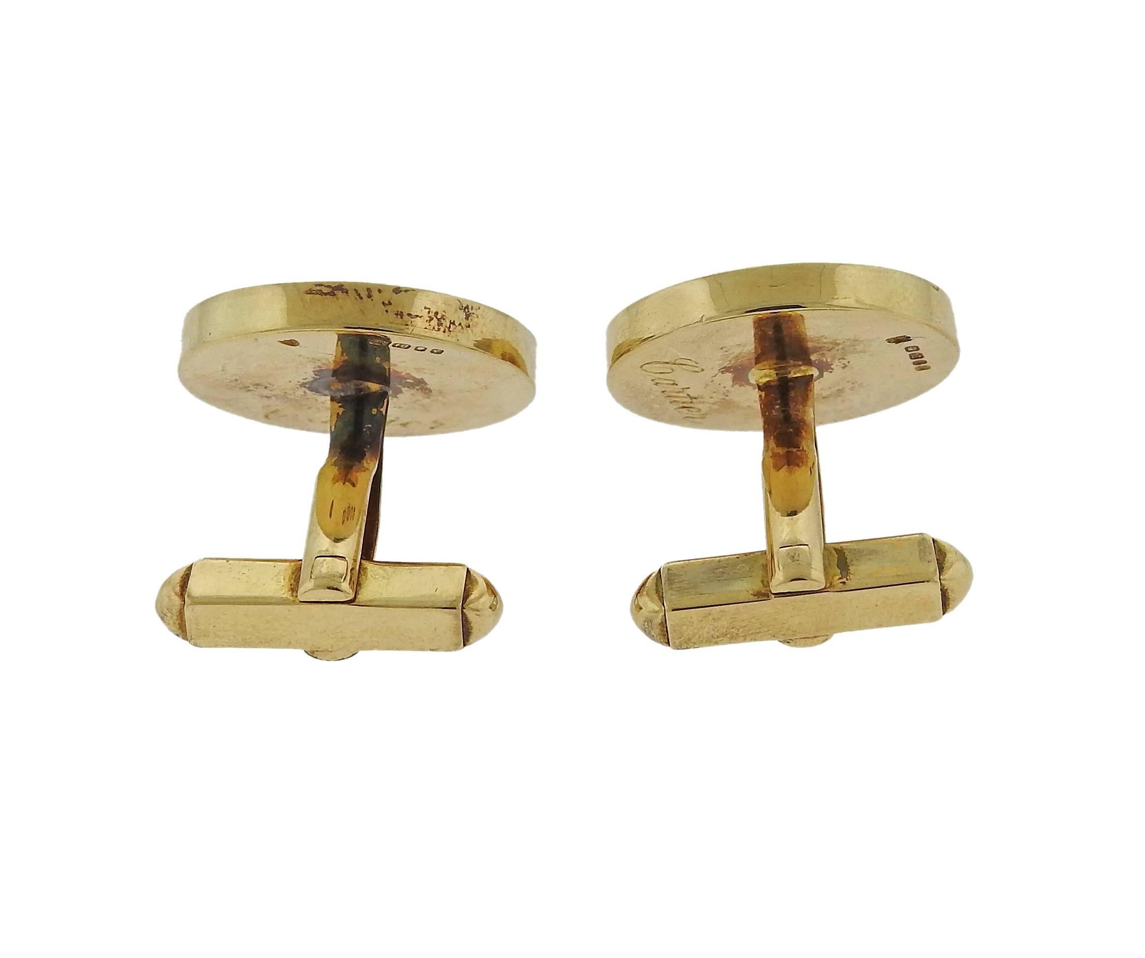 A pair of 18k yellow gold honeycomb design cufflinks, retailed by Cartier, crafted in England. Top of the cufflink measures 20.5mm in diameter, pair weighs 21.8 grams. Marked: Cartier, English gold assay marks,  2816