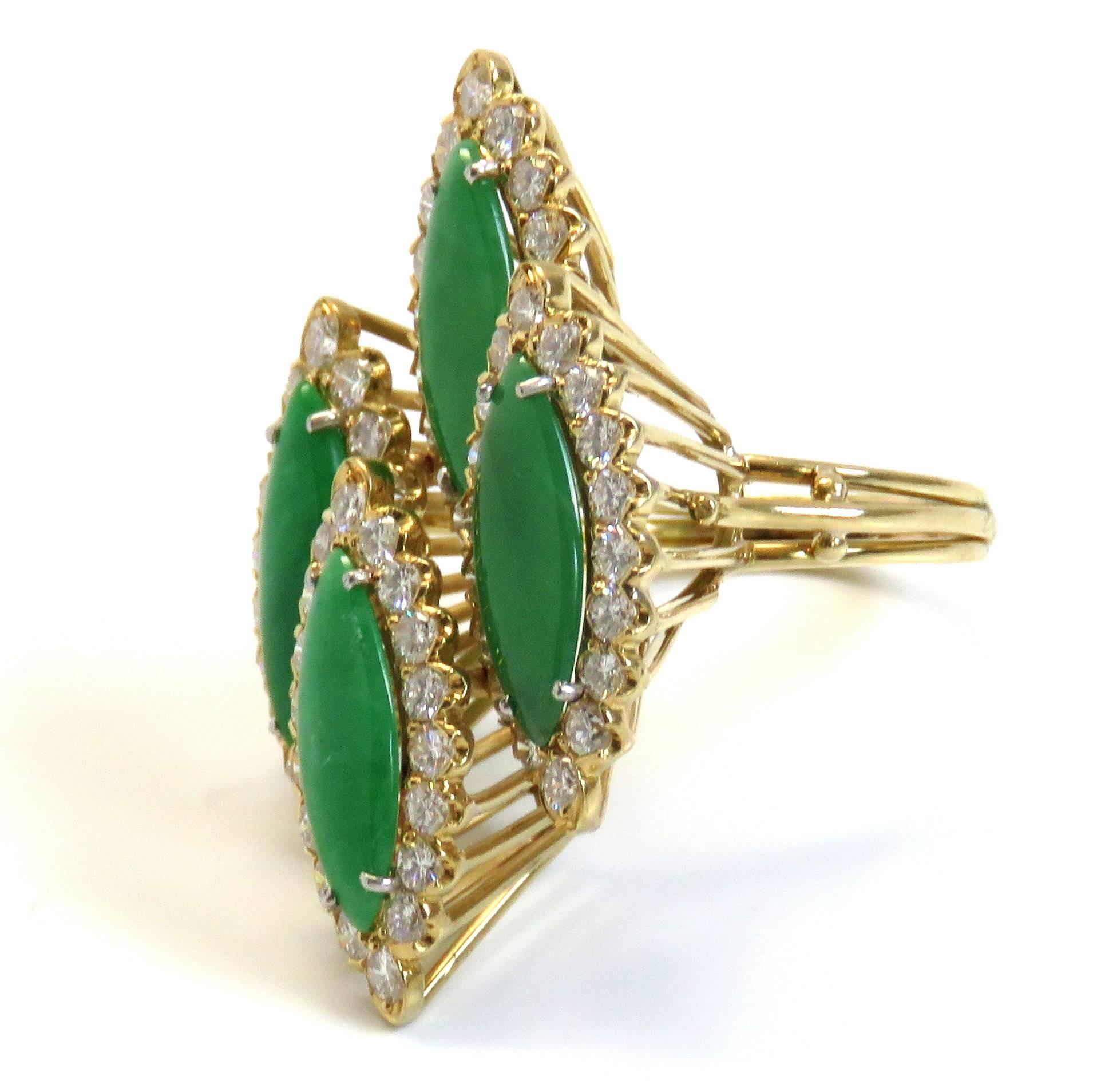 An 18k yellow gold ring set with jade and approximately 1.50ctw of GH/VS diamonds.  The ring is a size 7 and the top measures 38mm x 26mm.  The weight of the piece is 11.3 grams.