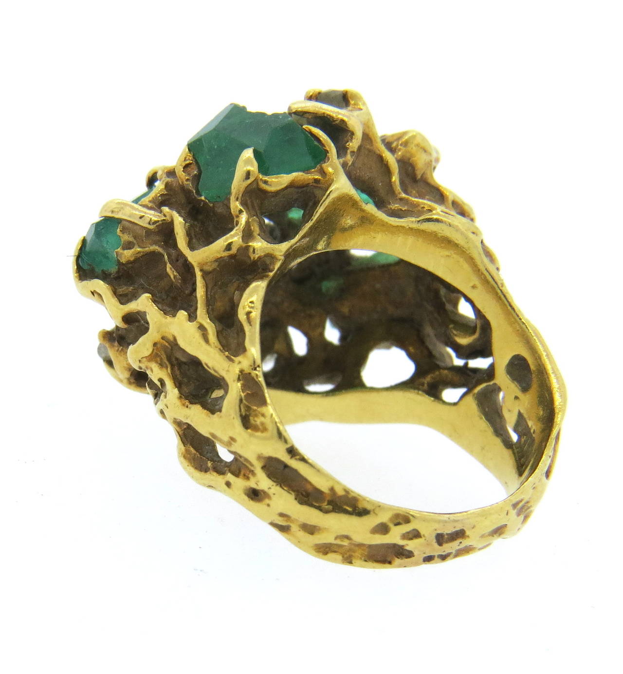 18k gold ring by Arthur King, featuring free form shape top, decorated with emeralds and approx. 0.50ctw in diamonds. Ring is a size 4 1/2, ring top is 17mm x 22mm. Marked 18k and King. Weight of the ring - 12.5 grams