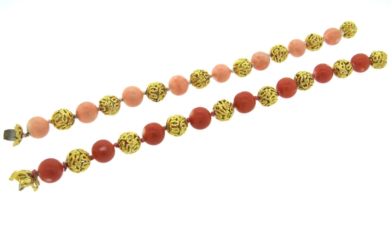 Set of two 18k gold bracelets, each set with 10mm coral beads. Bracelets are 7 1/2