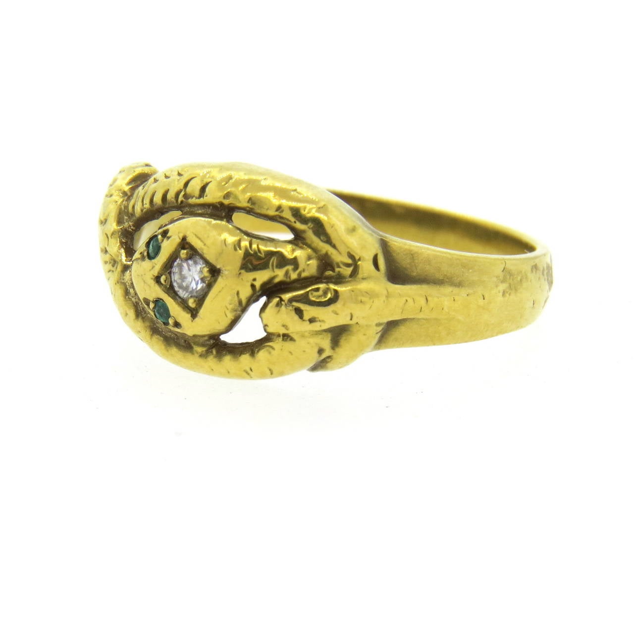 Victorian 14k gold ring, featuring snake , decorated with a diamond and emerald eyes. Ring is a size 9 1/2, ring top is 10.3mm wide. Weight of the piece - 4.7 grams