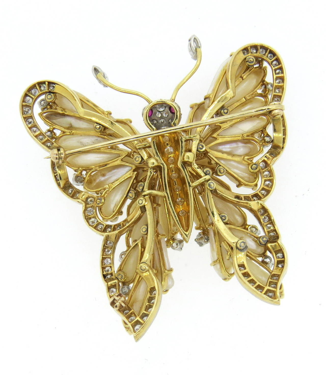 Large 18k gold butterfly brooch, featuring Mississippi pearls, decorated with approx. 3.80ctw in diamonds and ruby eyes. Brooch measures 57mm x 55mm. Weight of the piece - 45.3 grams