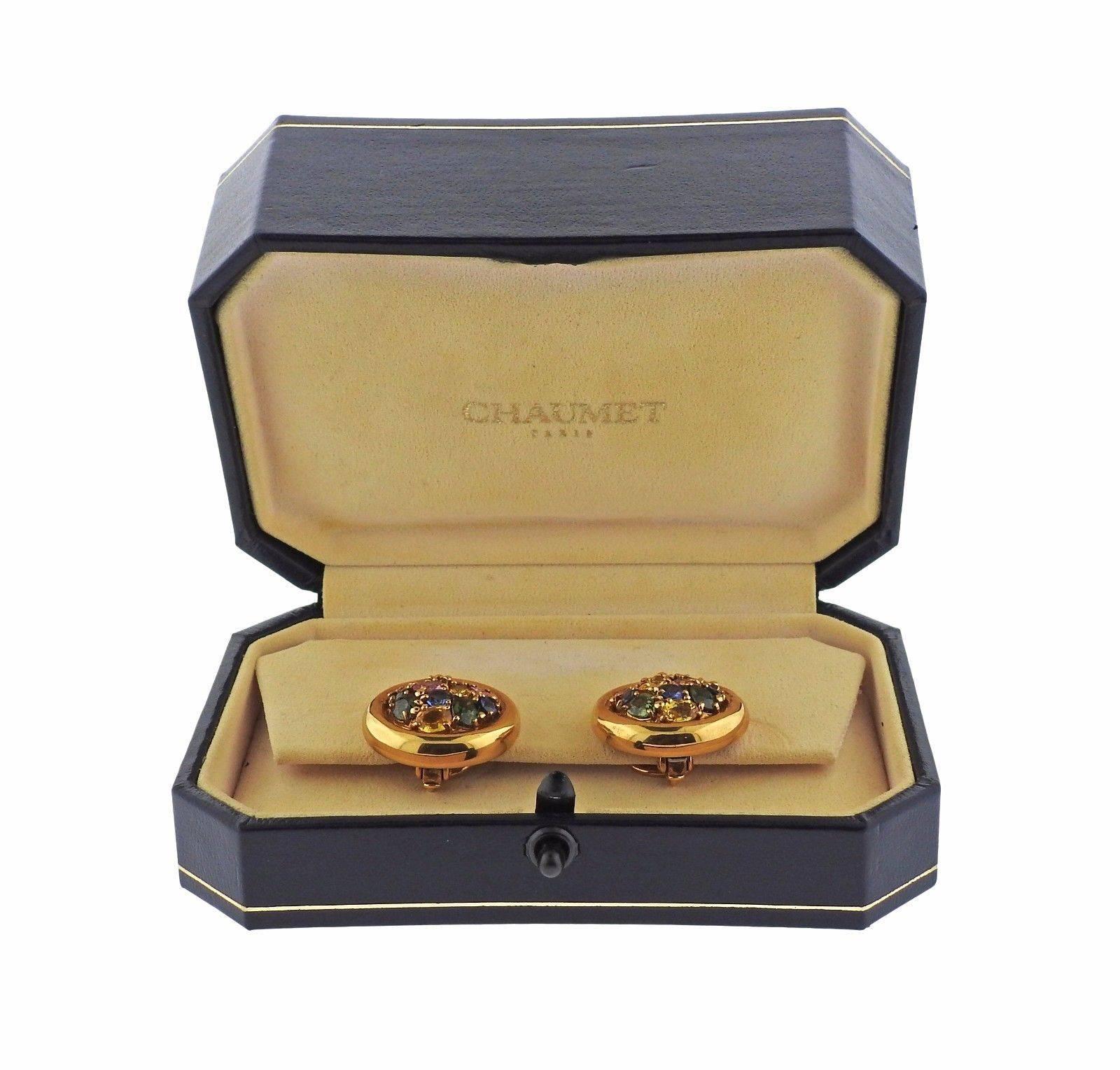 A pair of 18k yellow gold earrings set with multi color sapphires.  The earrings measure 22mm in diameter and weigh 21.3 grams.  Marked: Chaumet, Paris, 143436, or750. Come with original box.