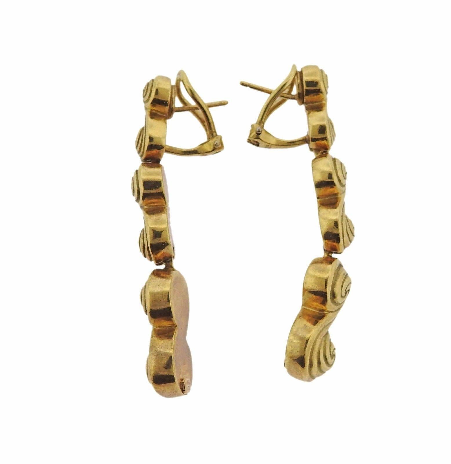 A pair of 18k yellow gold earrings by Tiffany & Co.  The earrings are 48mm long x 13mm at the widest point.  The weight of the pair is 26.2 grams.  Marked: T&Co, 750.