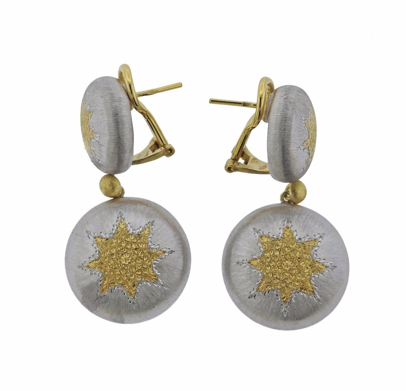 A pair of 18k yellow gold and sterling silver earrings from the Geminato collection by Buccellati.  The earrings measure 38mm long x 20mm wide and weigh 16.4 grams.  Marked: P4019, Buccellati, Buccellati, 925, 750.  The earrings currently retail for