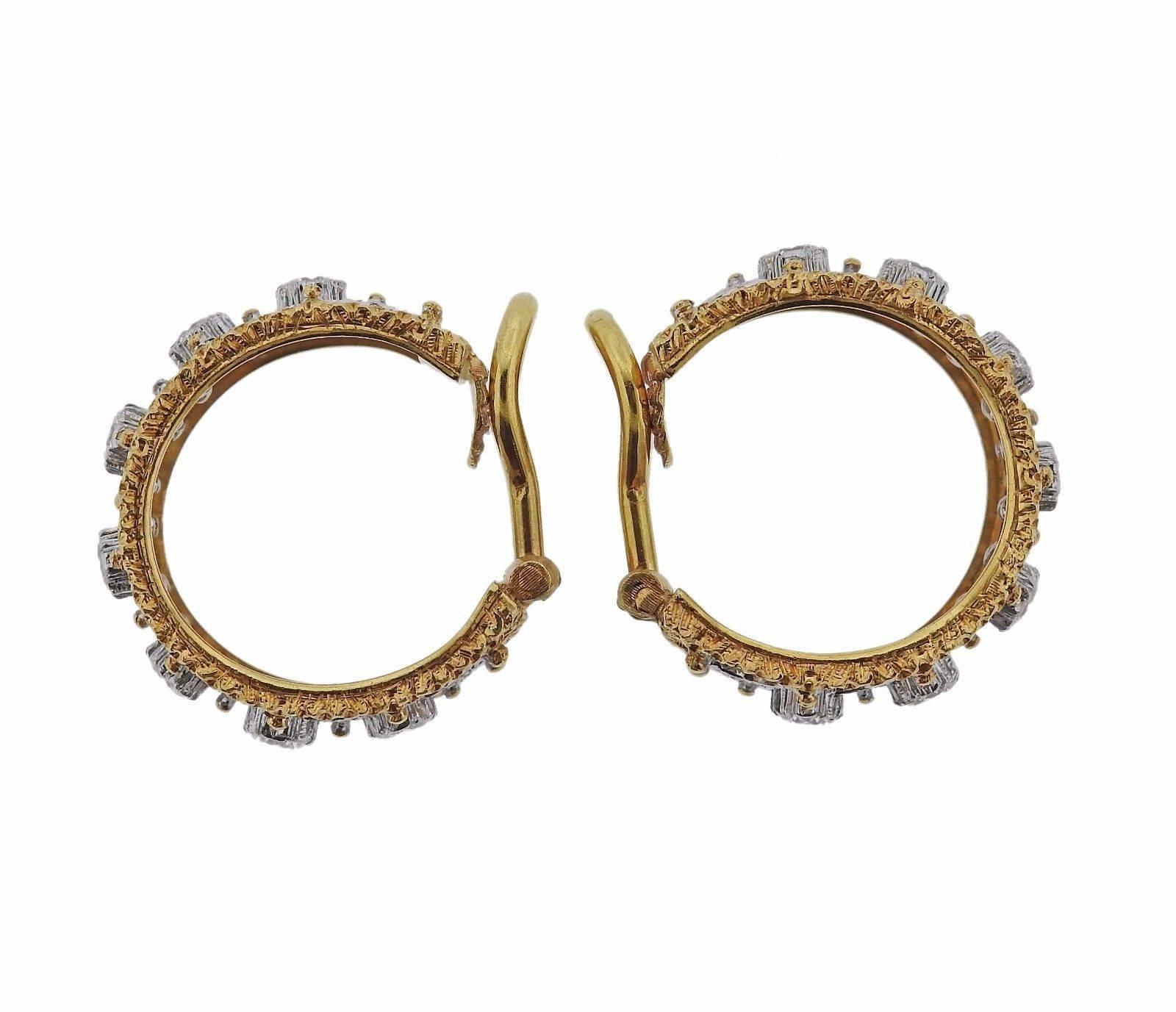 A pair of 18k gold hoop earrings set with 1.28ctw of GH/VS diamonds.  The earrings measure 21mm x 9mm and weigh 10.8 grams.  Marked: Buccellati,Italy, 18k,D2293.  The current retail is $26,700.