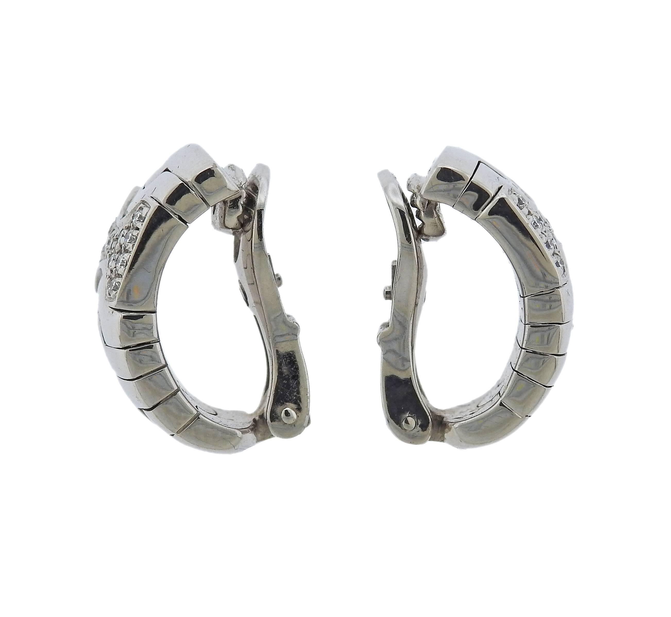 Pair of 18k white gold half hoop earrings, crafted by Bulgari for Parentesi collection, set with approx. 0.30ctw in G/VS diamonds. Earrings are 19mm x 11mm , marked: Bvlgari, 750, made in Italy. Weight - 21.1 grams 