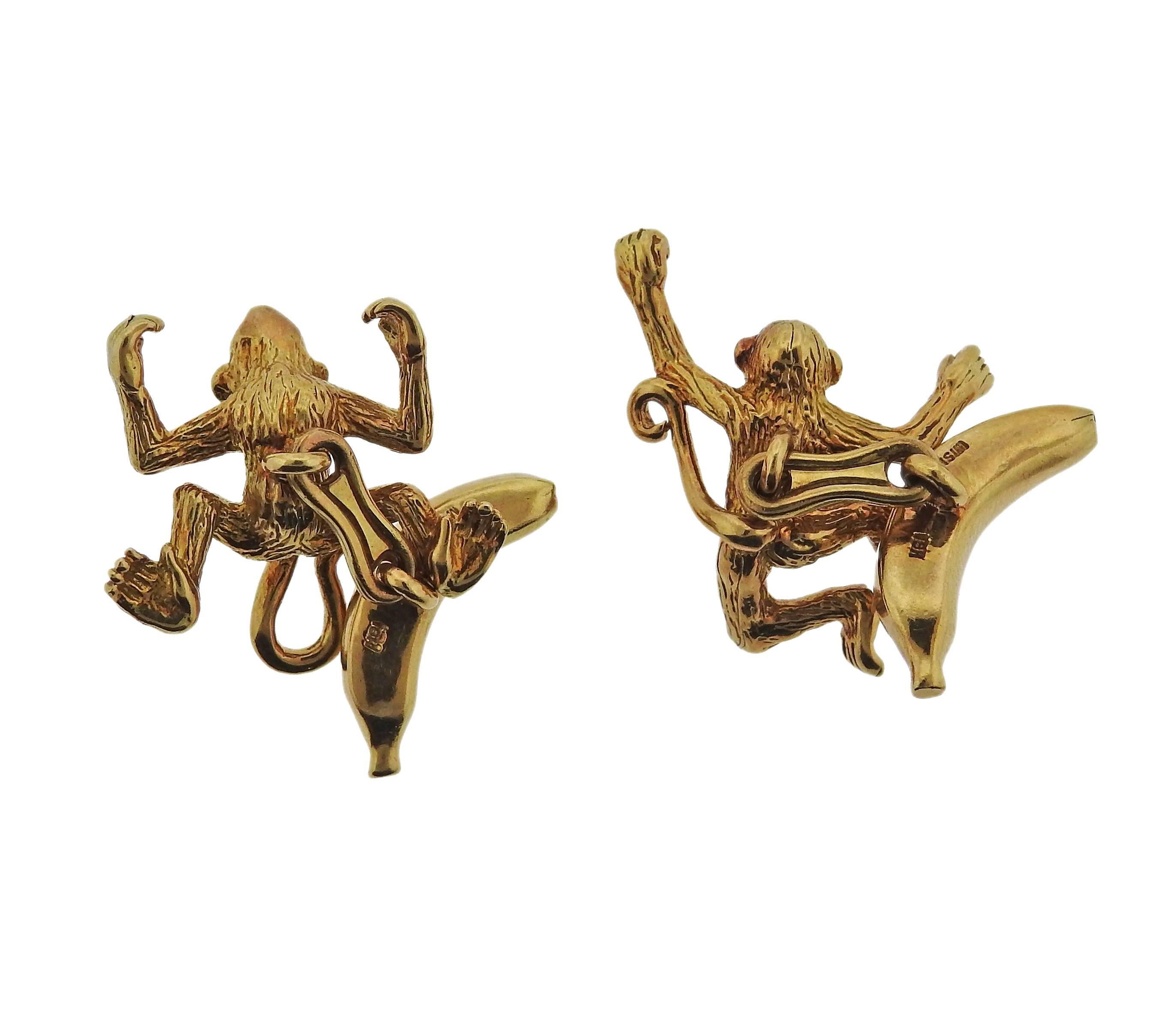 Pair of whimsical 18k gold monkey & banana cufflinks, crafted by Mish New York. Monkeys measure 23mm x 24mm and 32mm x 23mm. Marked: Mish and 18k. Weight - 31.3 grams 