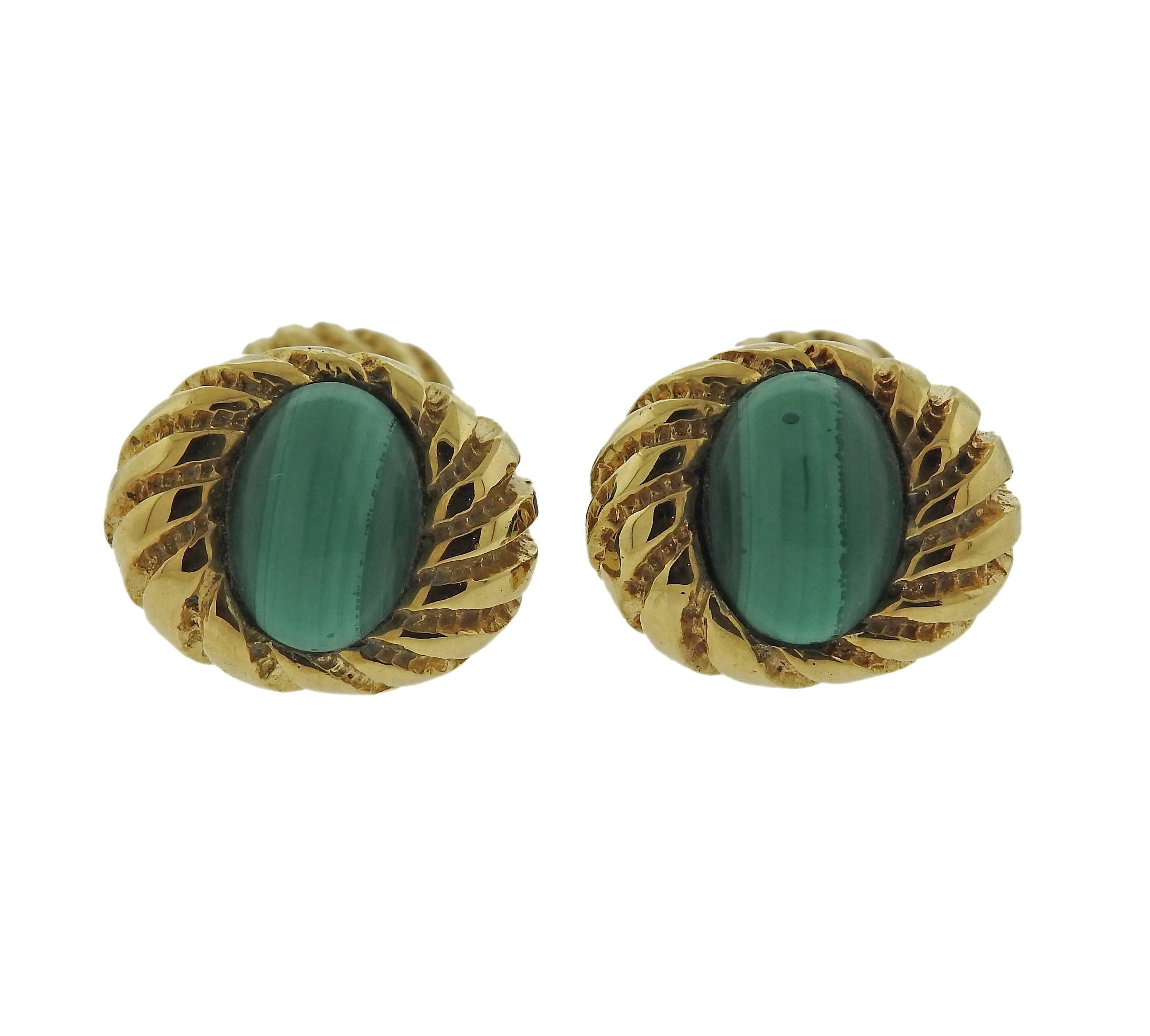A pair of 18k gold cufflinks featuring malachite, crafted by Jean Schlumberger for Tiffany & Co. Cufflink tops measure 18mm X 15mm, backs measure 11mm X 9mm. Marked Tiffany & Co 18k Schlumberger. Weight is 16.5 grams.