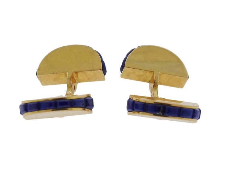 A pair of 18k gold cufflinks featuring lapis, crafted by Cartier. Cufflink tops measure 15mm X 8.5mm. Marked Cartier, Paris, 010 CCO, French marks. Weight is 11 grams. 