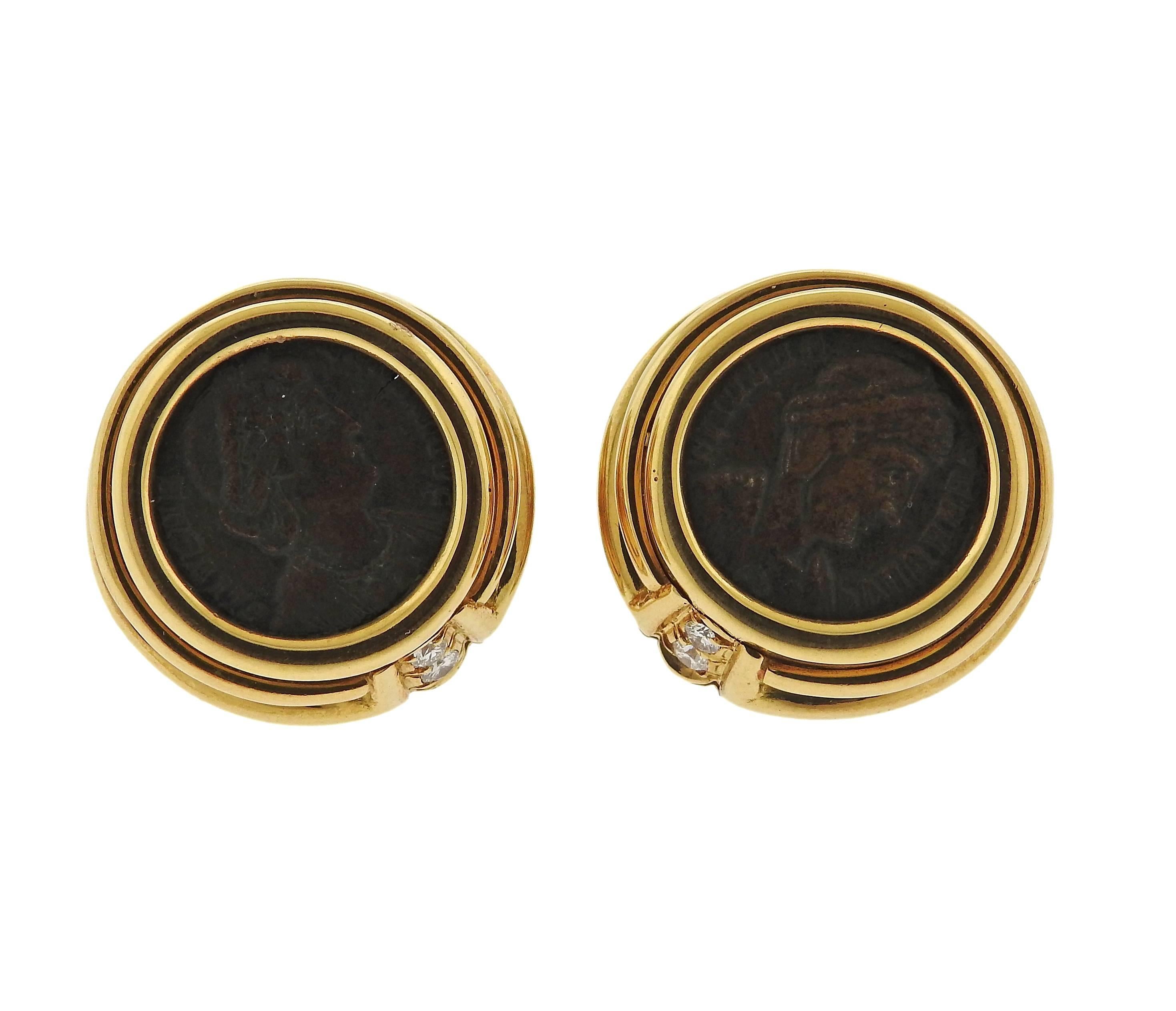 A pair of 18k gold ancient coin earrings featuring approximately 0.10ctw of G/VS diamonds. Earrings measure 20mm in diameter. Marked Roma-Helena, 4 328 D.C., Bvlgari, 750. Weight is 27.8 grams. 