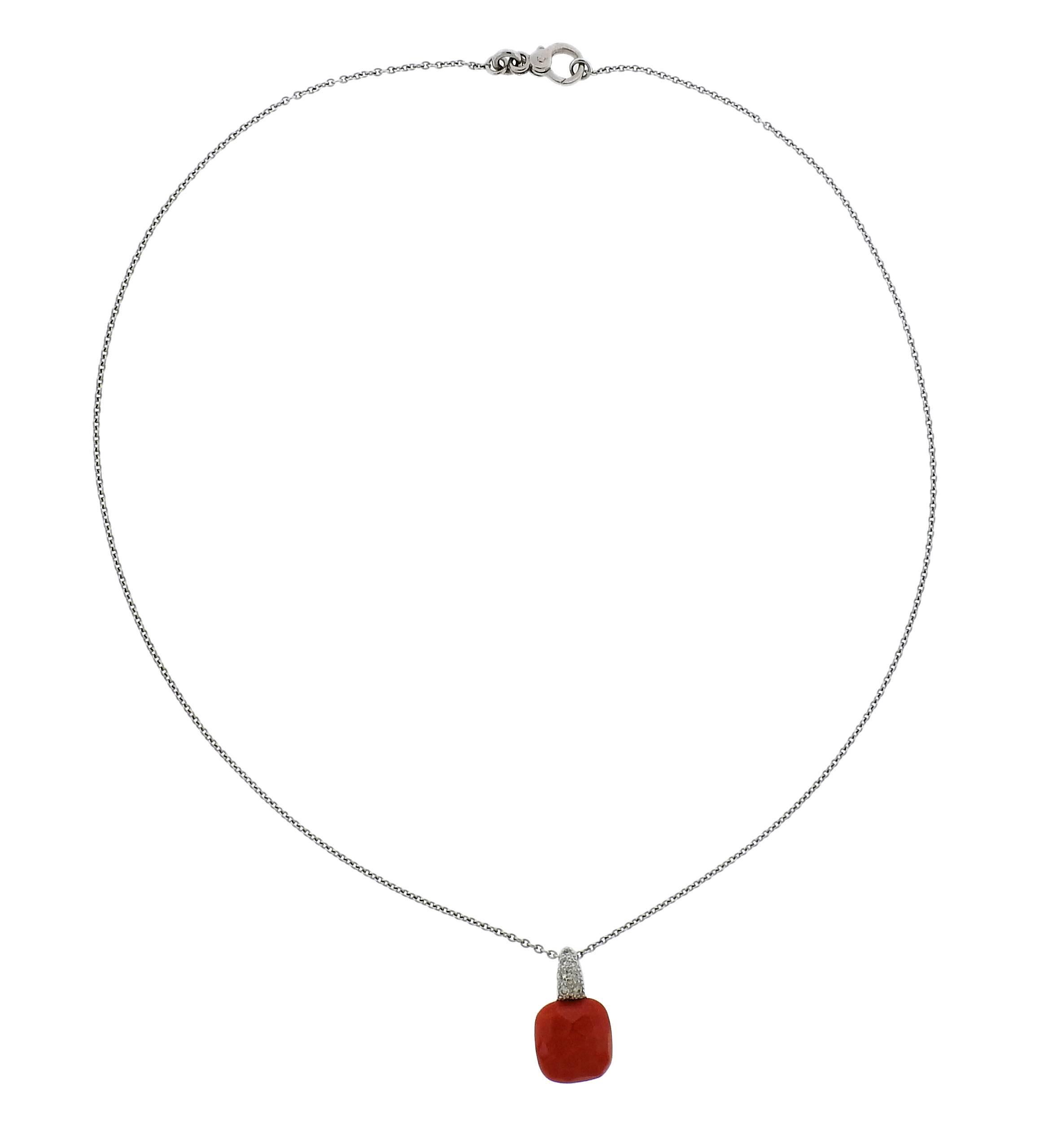 An 18k gold necklace crafted by Pomellato for the Capri collection. Features approximately 0.10ctw of G/VS diamonds and coral. Necklace measures 15 3/4" long, pendant measures 18mm X 11mm. Weight is 5.4 grams. 