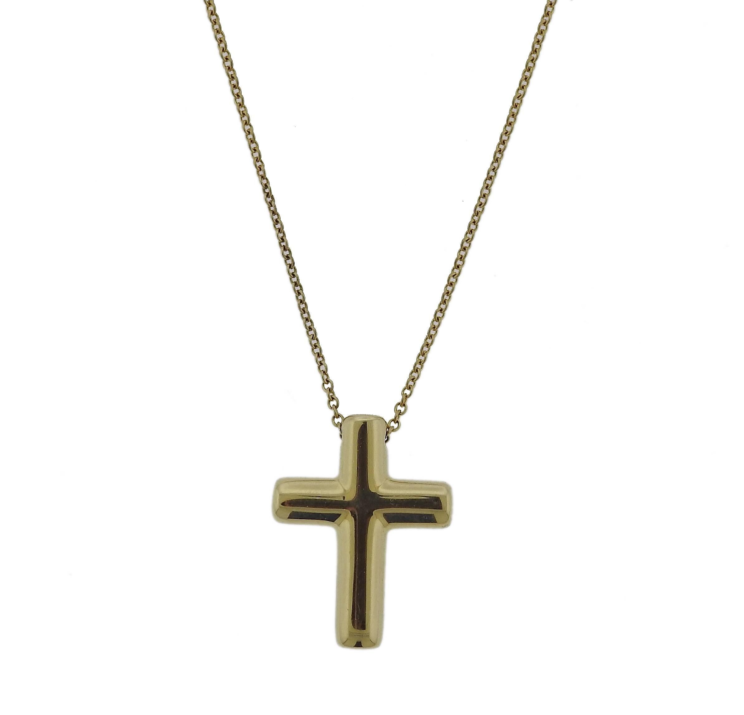 An 18k yellow gold cross pendant necklace crafted by Tiffany & Co for the Etoile collection. Features approximately 0.08ctw of G/VS diamonds. Necklace measures 16 1/4" long, pendant - 20mm x 15mm. Weight is 4.8 grams. 