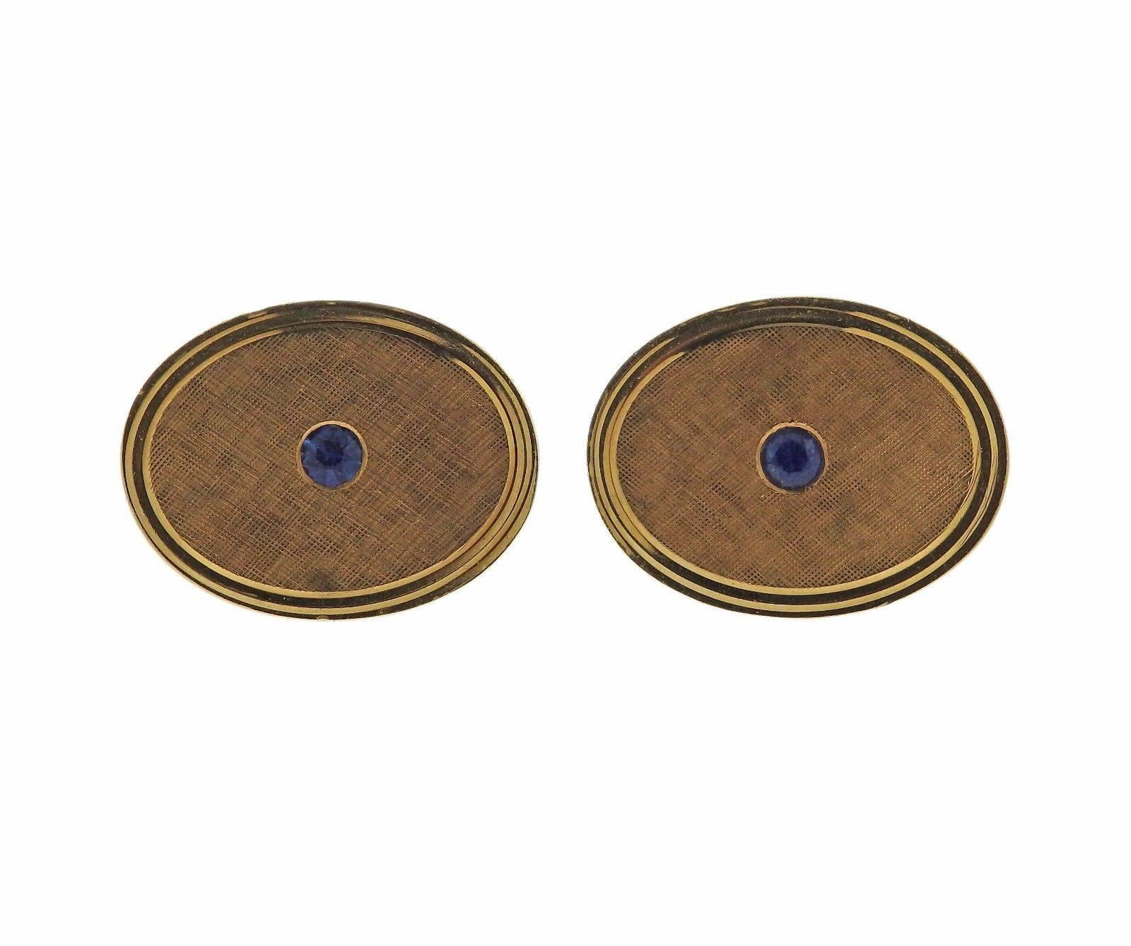 A pair of 14k yellow gold cufflinks set with Montana sapphires.  The cufflinks measure 21mm x 16mm and weigh 15.1 grams.  Marked: 14k, Tiffany.