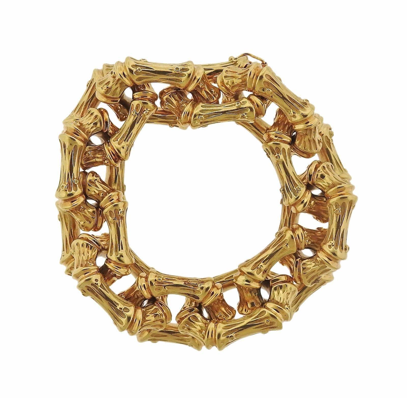 An 18k yellow gold bamboo motif bracelet by Tiffany & Co.  The bracelet is 8 3/4" long and 23mm wide.  The weight of the piece is 178.1 grams.  Marked: Tiffany , 18k.