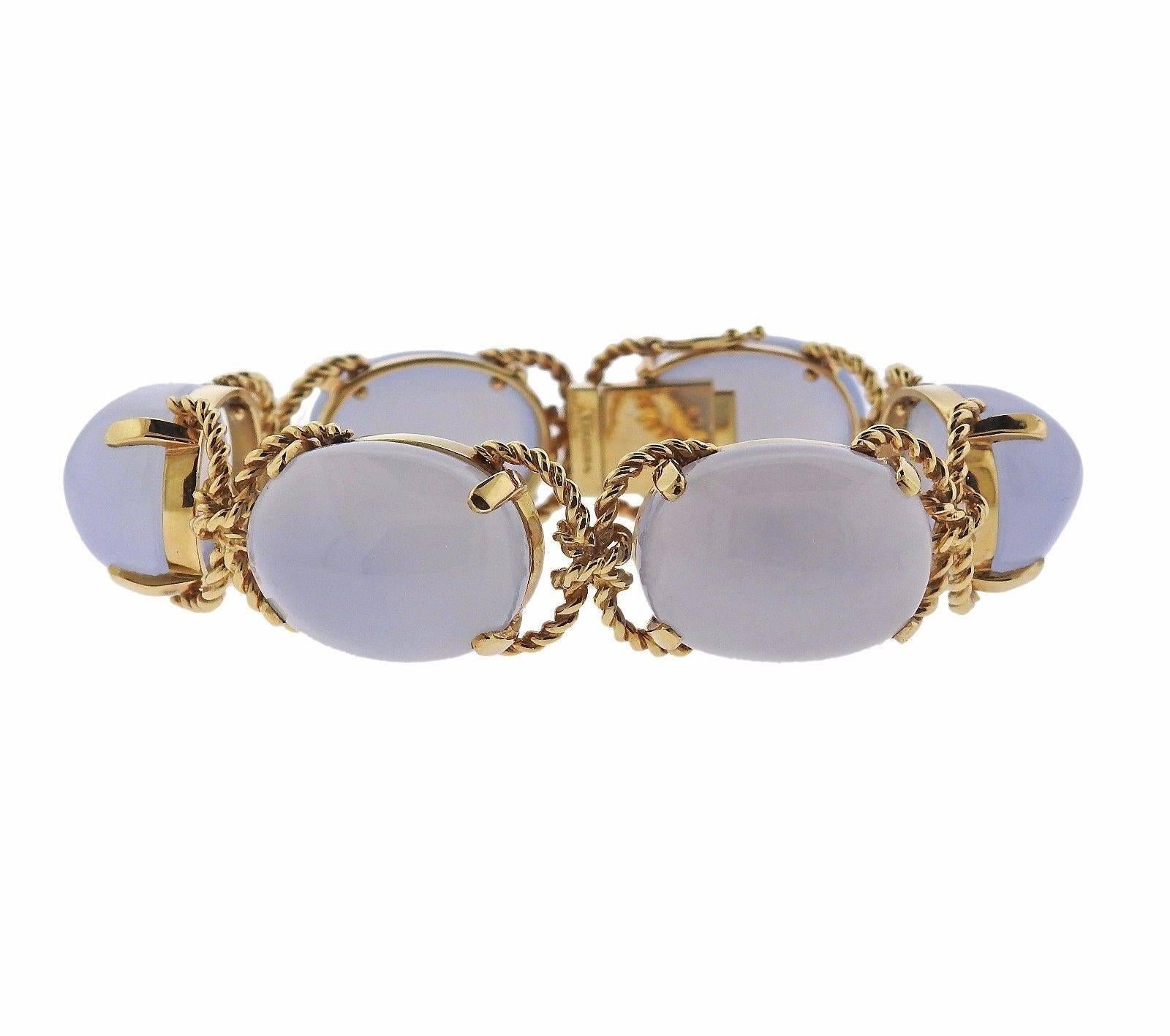 An 18k yellow gold bracelet set with chalcedony cabochons (23mm x 17.5mm x 12mm).  The bracelet is 7" long and 18mm wide. The weight of the piece is 74.7 grams. Marked: VB8960, Verdura, 750.
