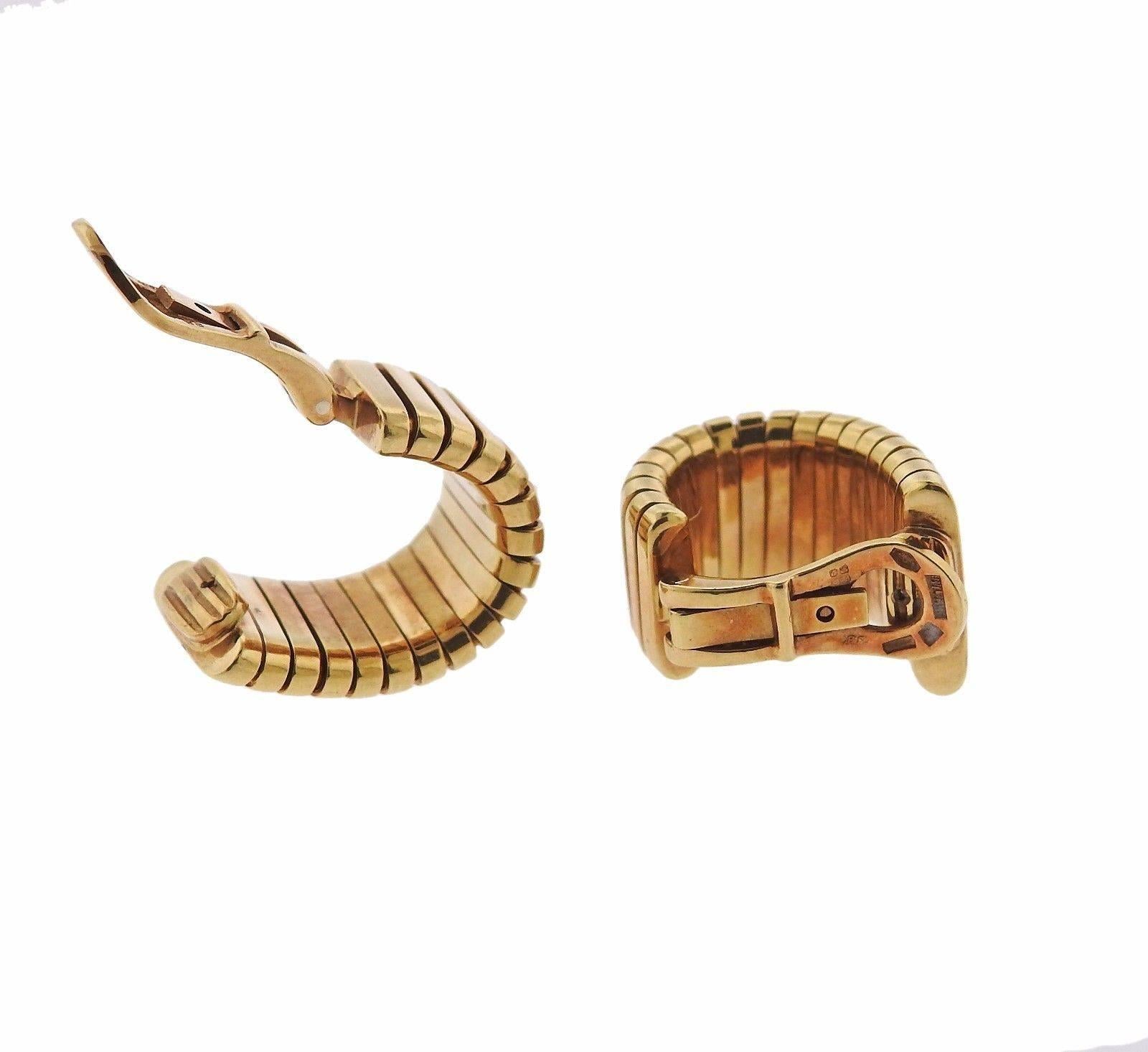 A pair of 18k yellow gold earrings from the Tubogas collection by Bulgari.  The earrings measure 21mm x 14mm and weigh 31.3 grams.  Marked: Bvlgari, made in Italy, 750, S B.